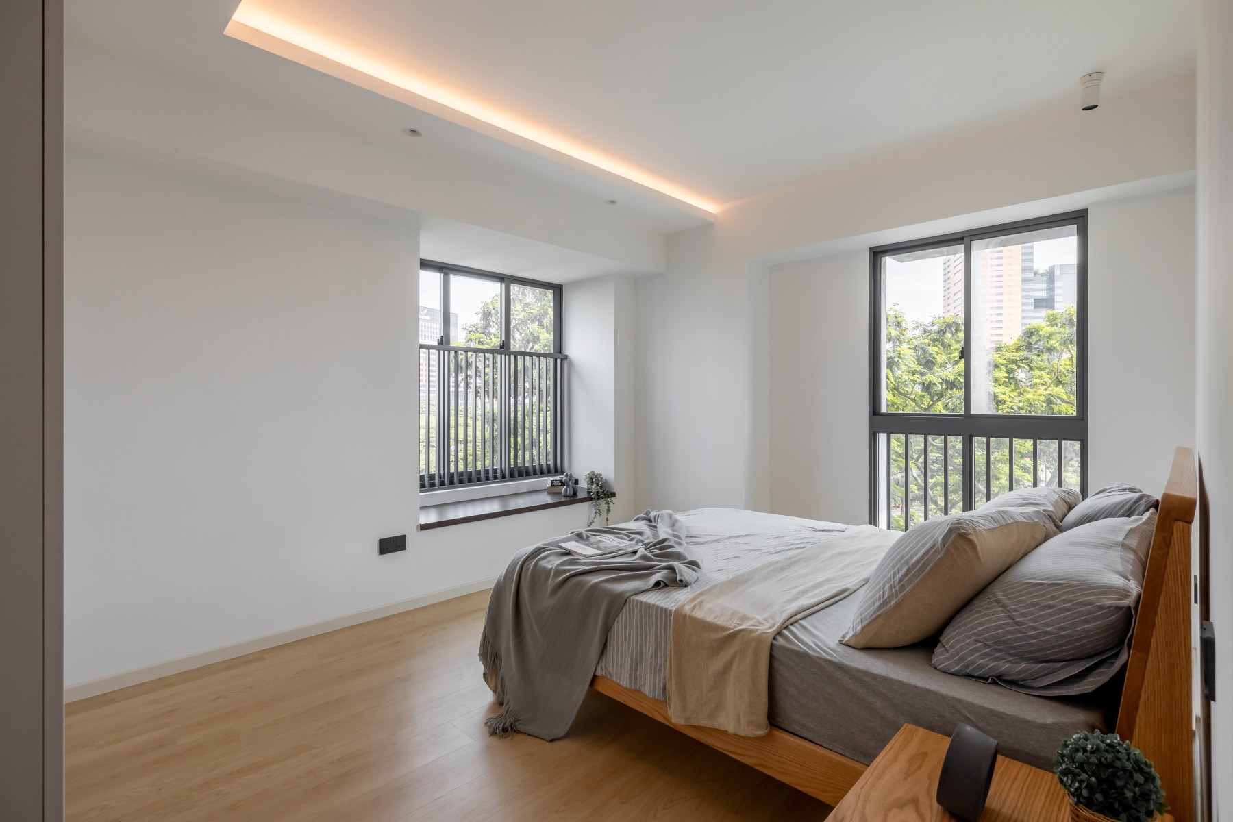 Minimalist Bedroom with Vinyl Flooring and Bay Window