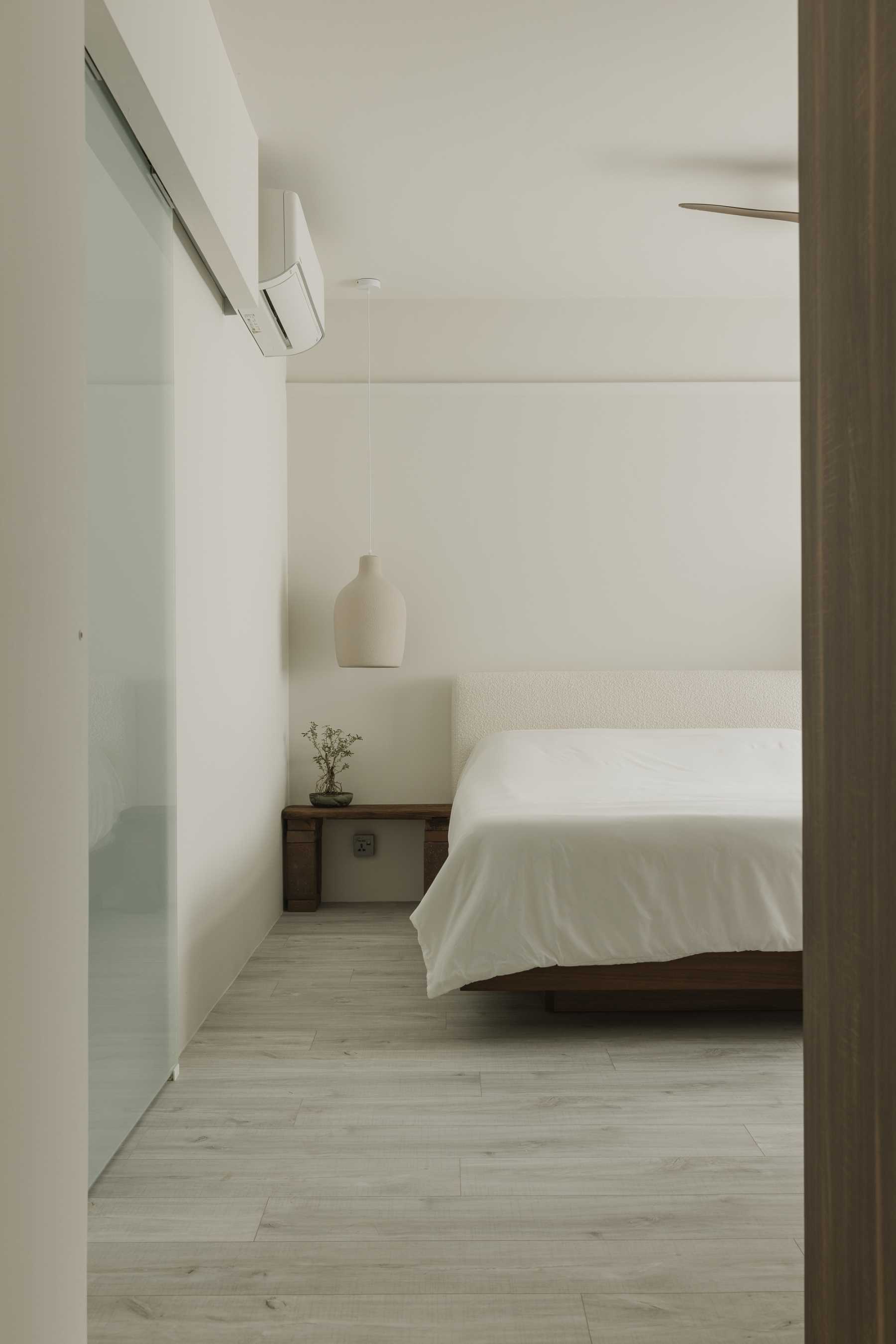 Minimalist Bedroom with Bedside Table and Flooring