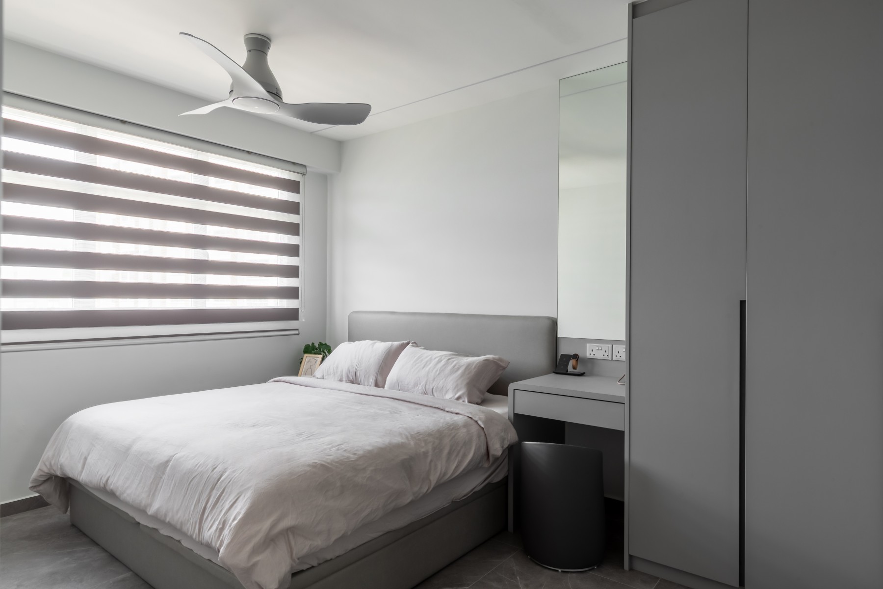 Minimalist Bedroom with Homogeneous Tiles and Wardrobe