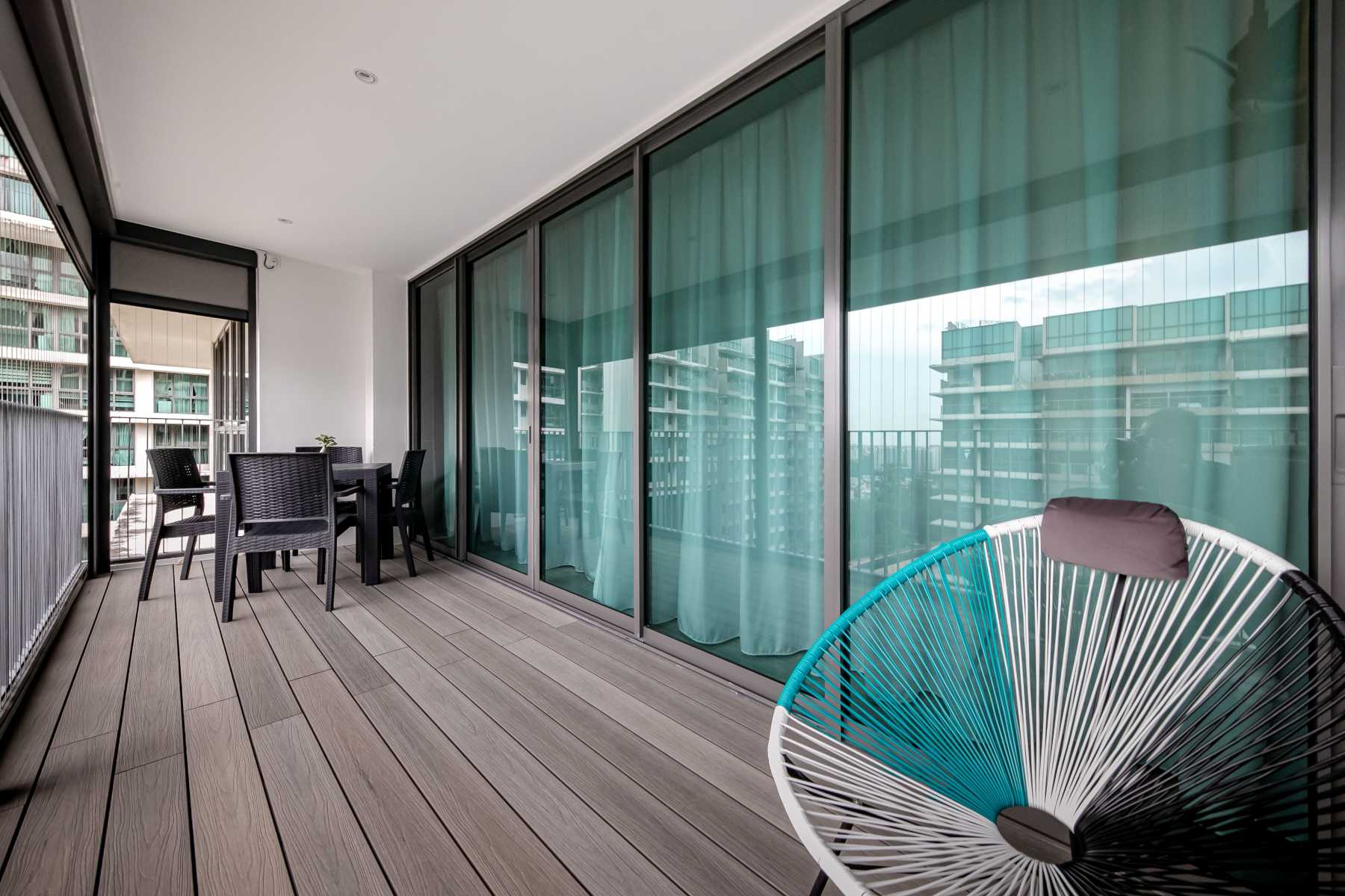 Modern Balcony with Window Grille and Outdoor Chairs