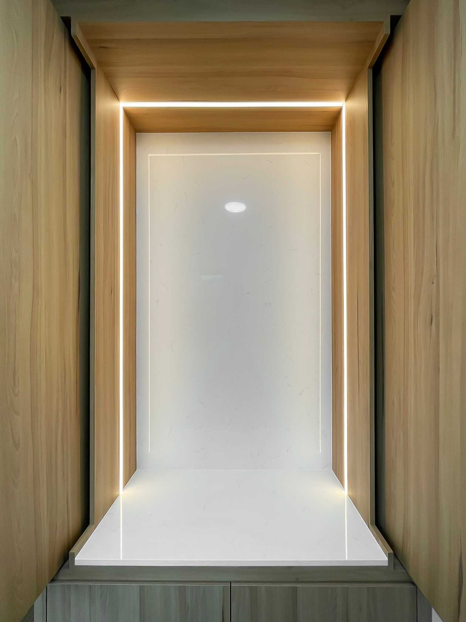 Scandinavian Foyer with Paintings and Display Cabinets