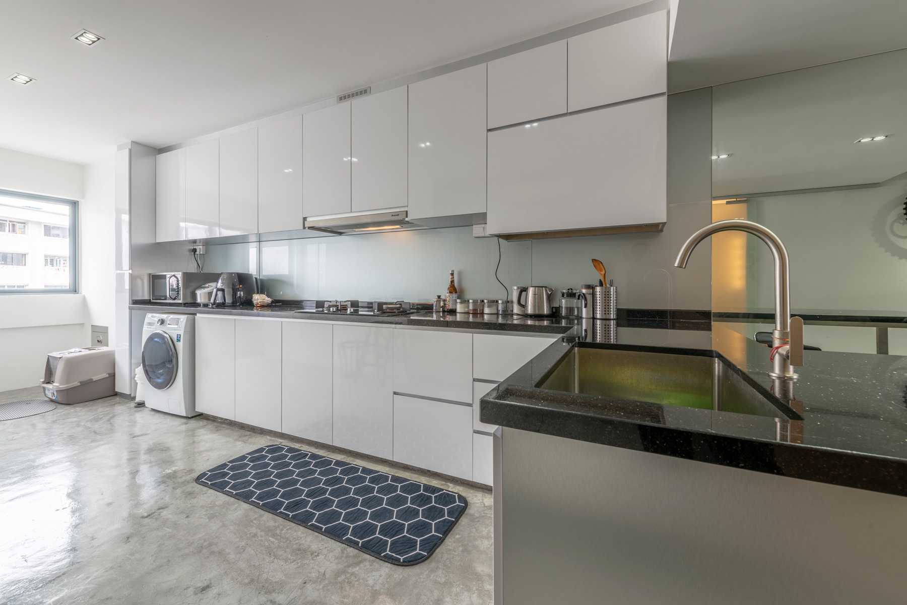 Industrial Kitchen with Countertop and Cement Floor