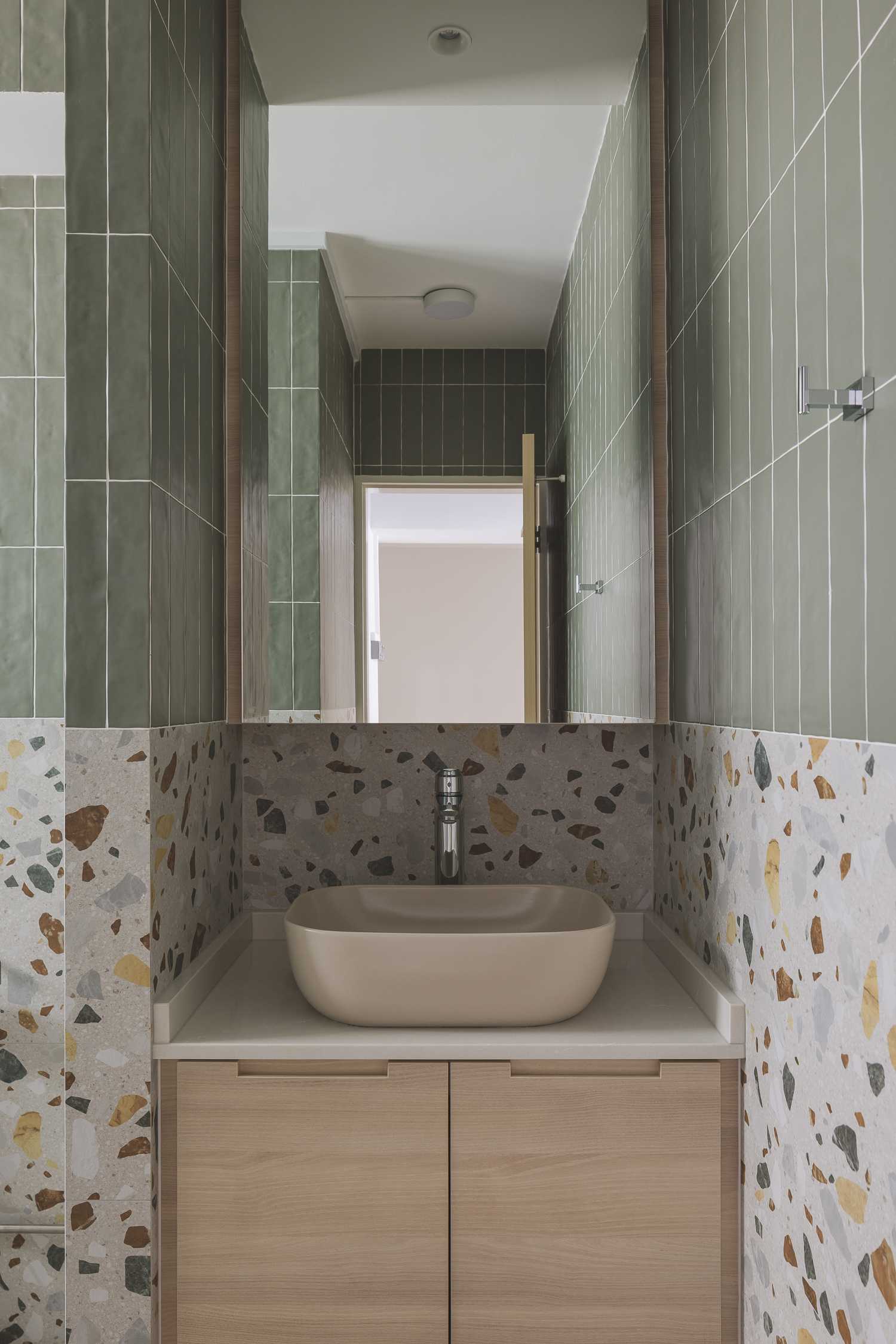 Modern Bathroom with Mirror and Green Wall