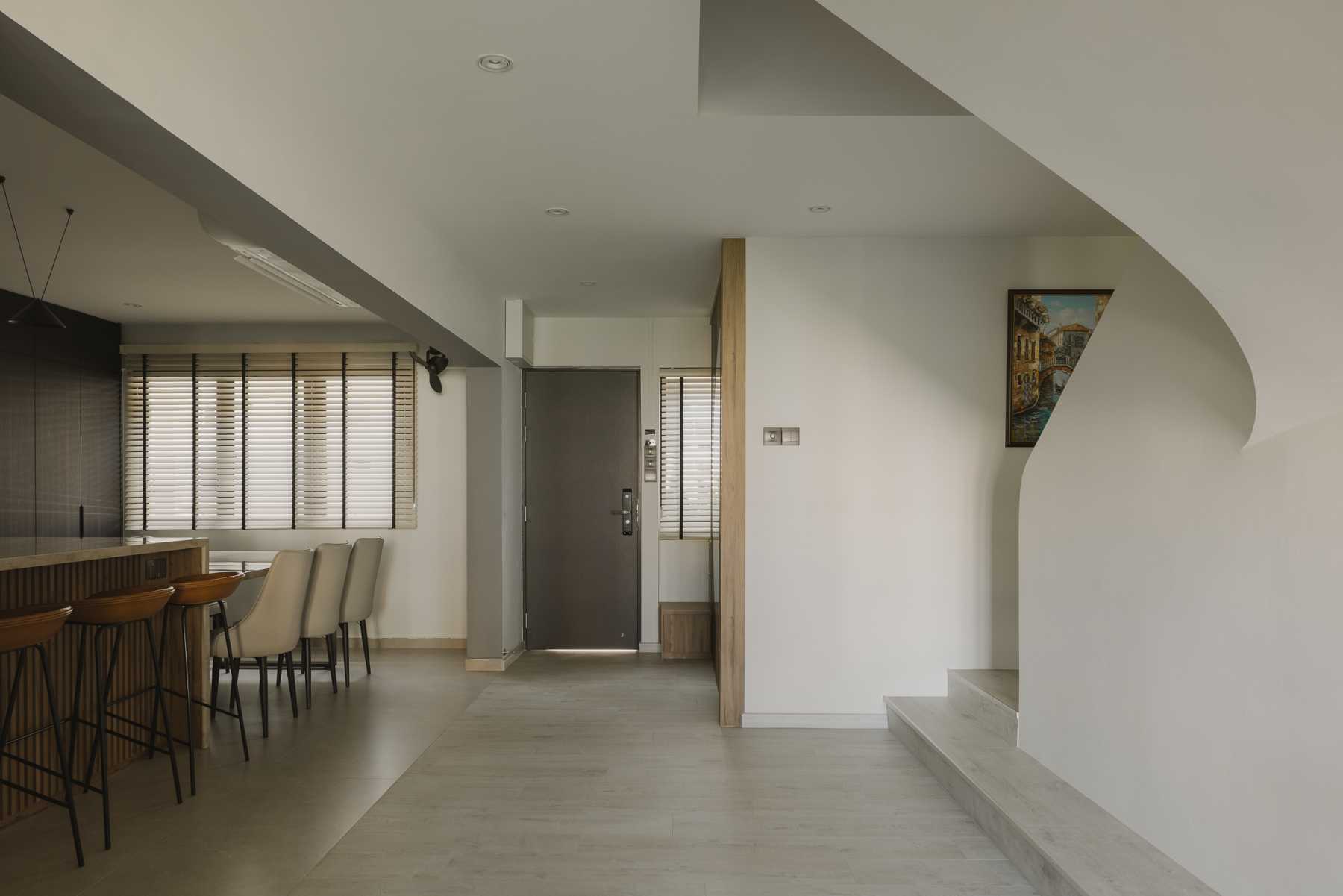 Modern Foyer with Countertop and Staircase