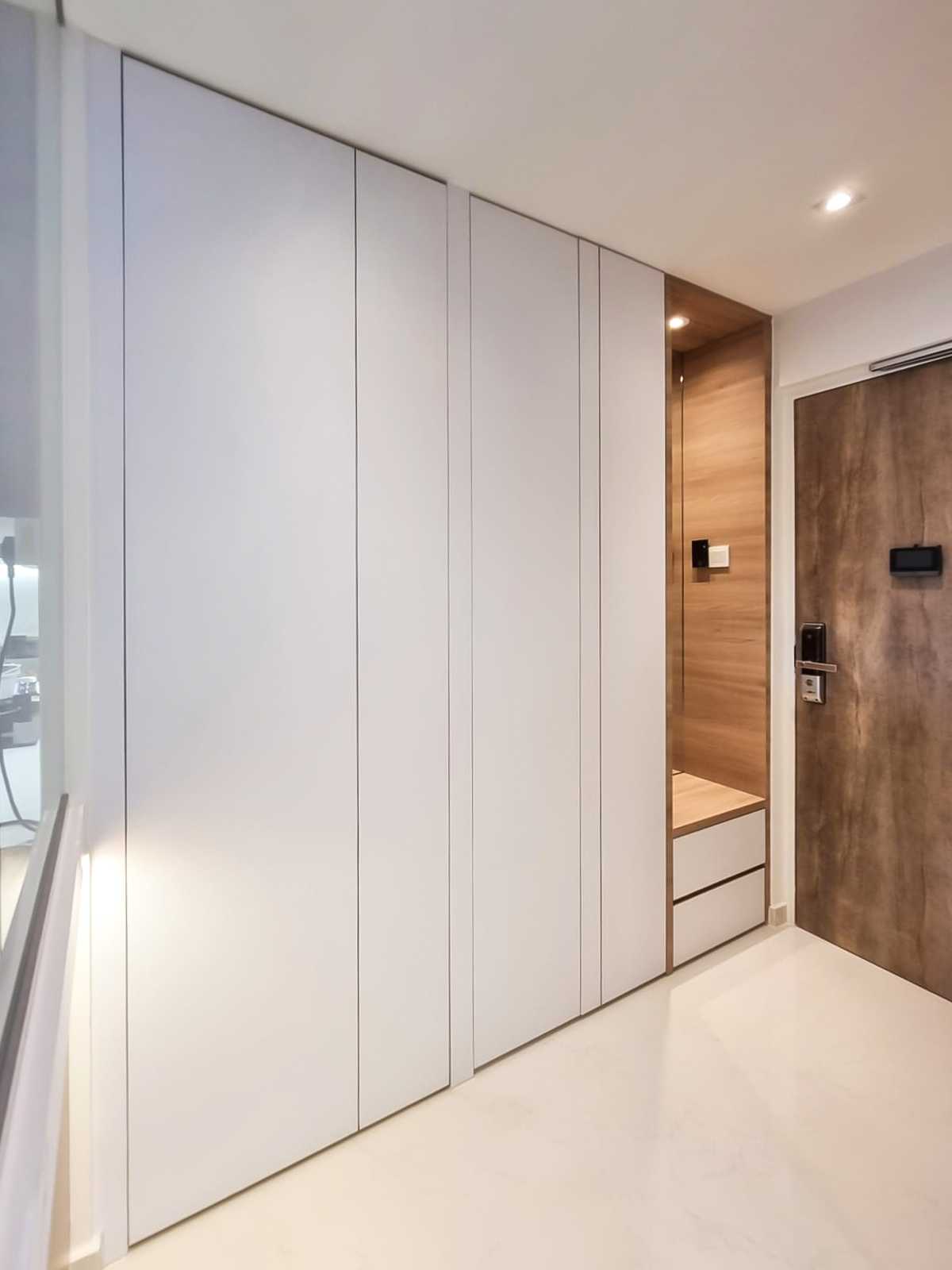 Scandinavian Foyer with Paintings and Storage Cabinets