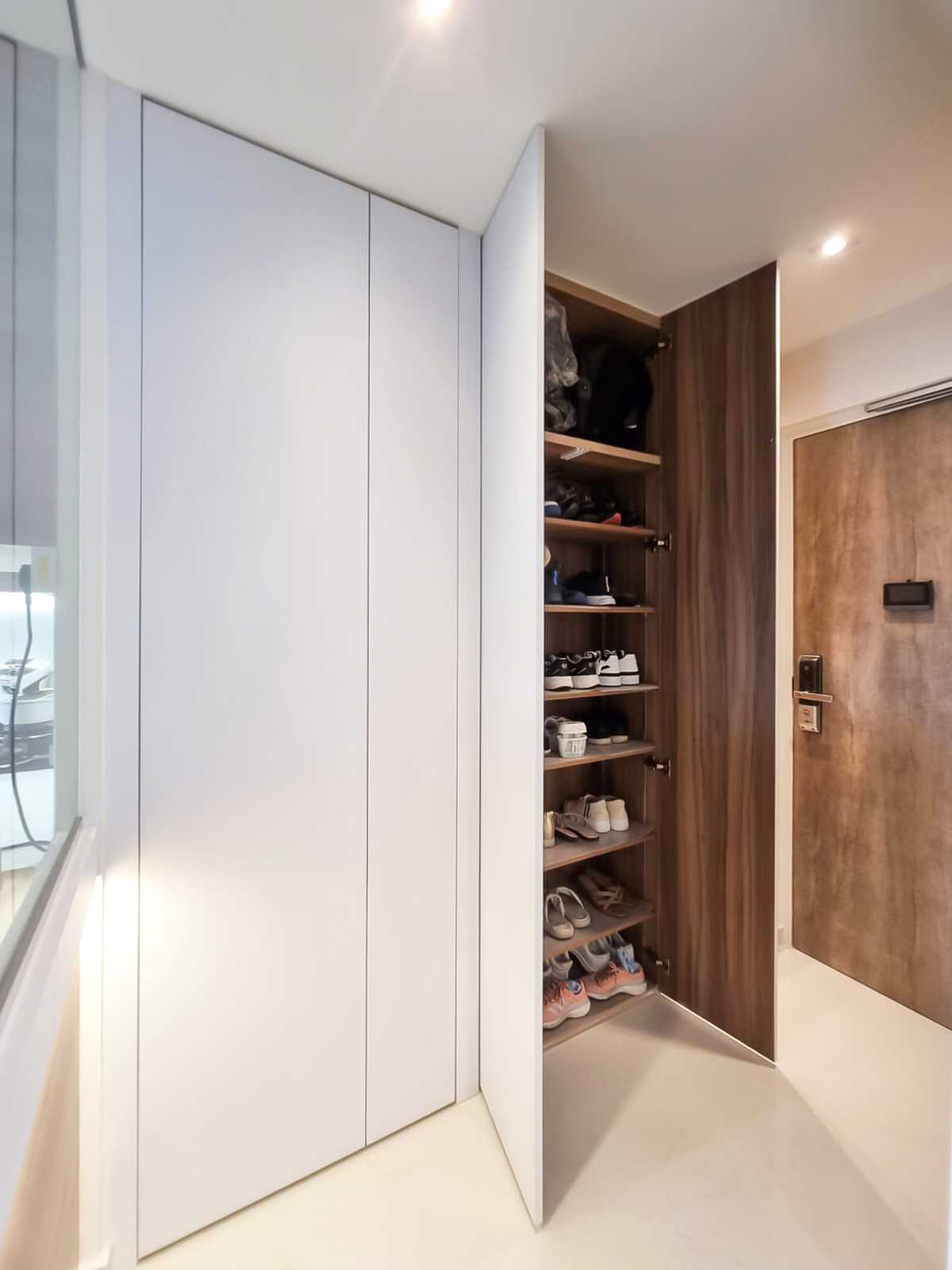 Scandinavian Foyer with Paintings and Storage Cabinets