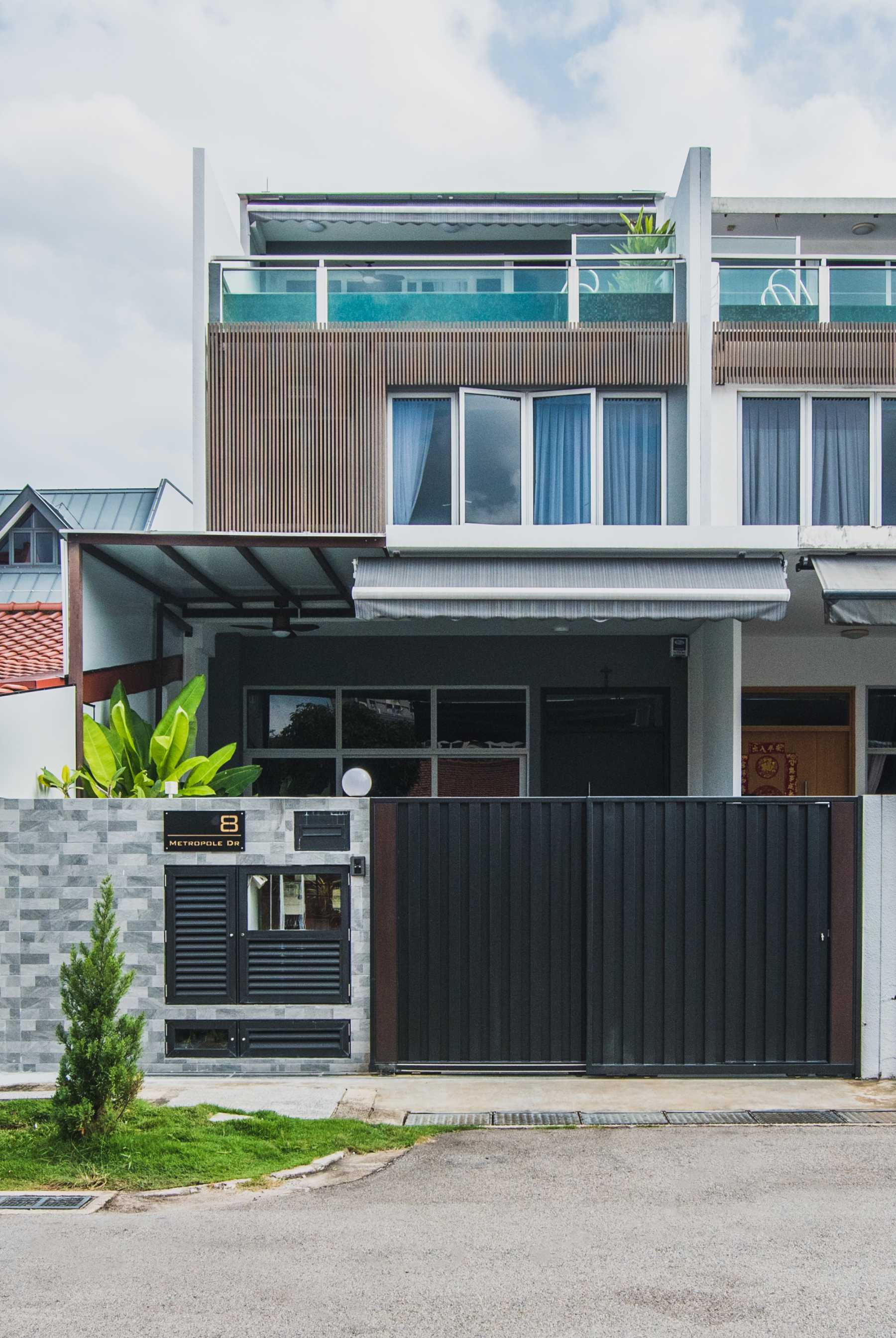 Contemporary Porch with Awning and Metal Gate