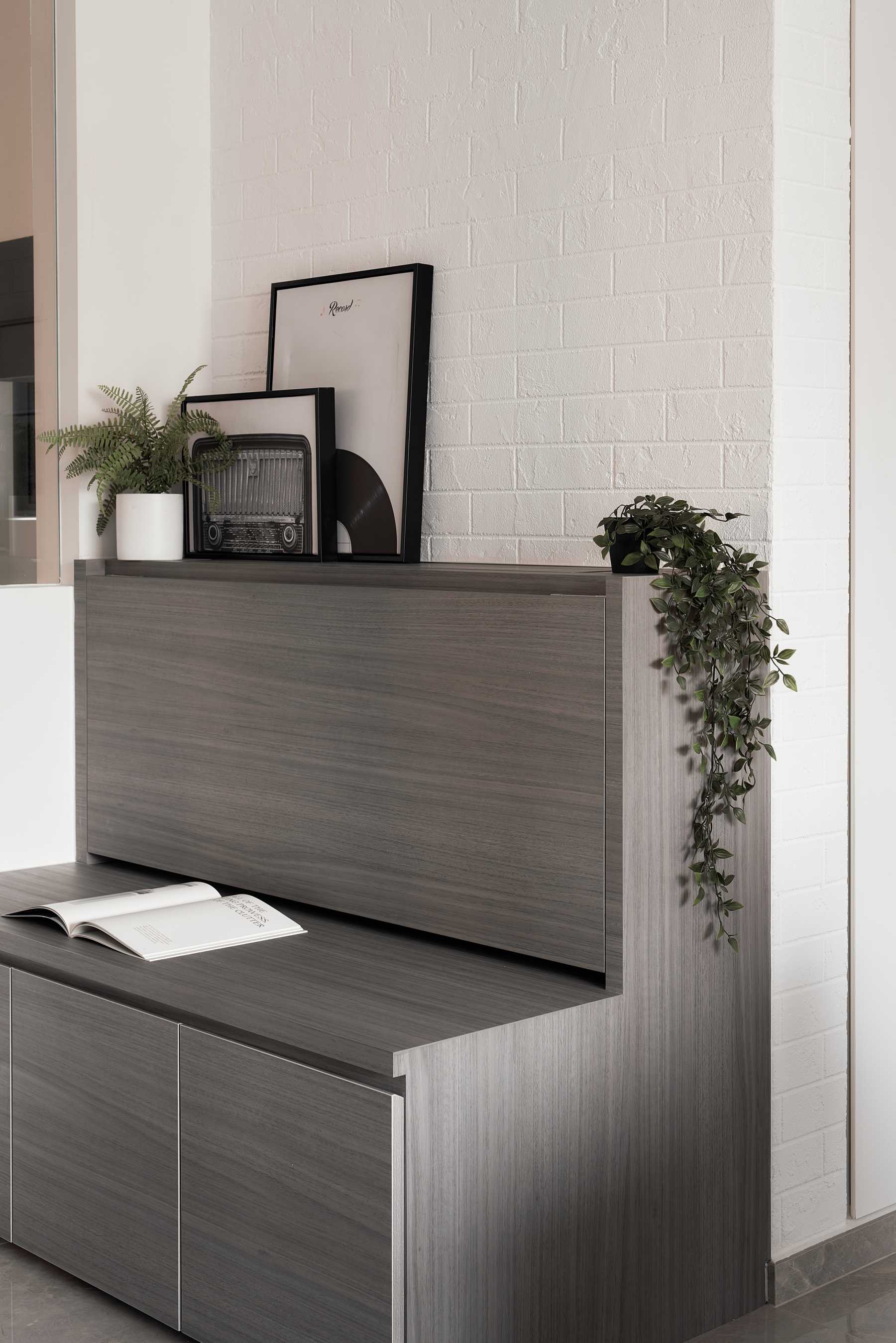 Modern Living Room with Bookshelf and Paintings