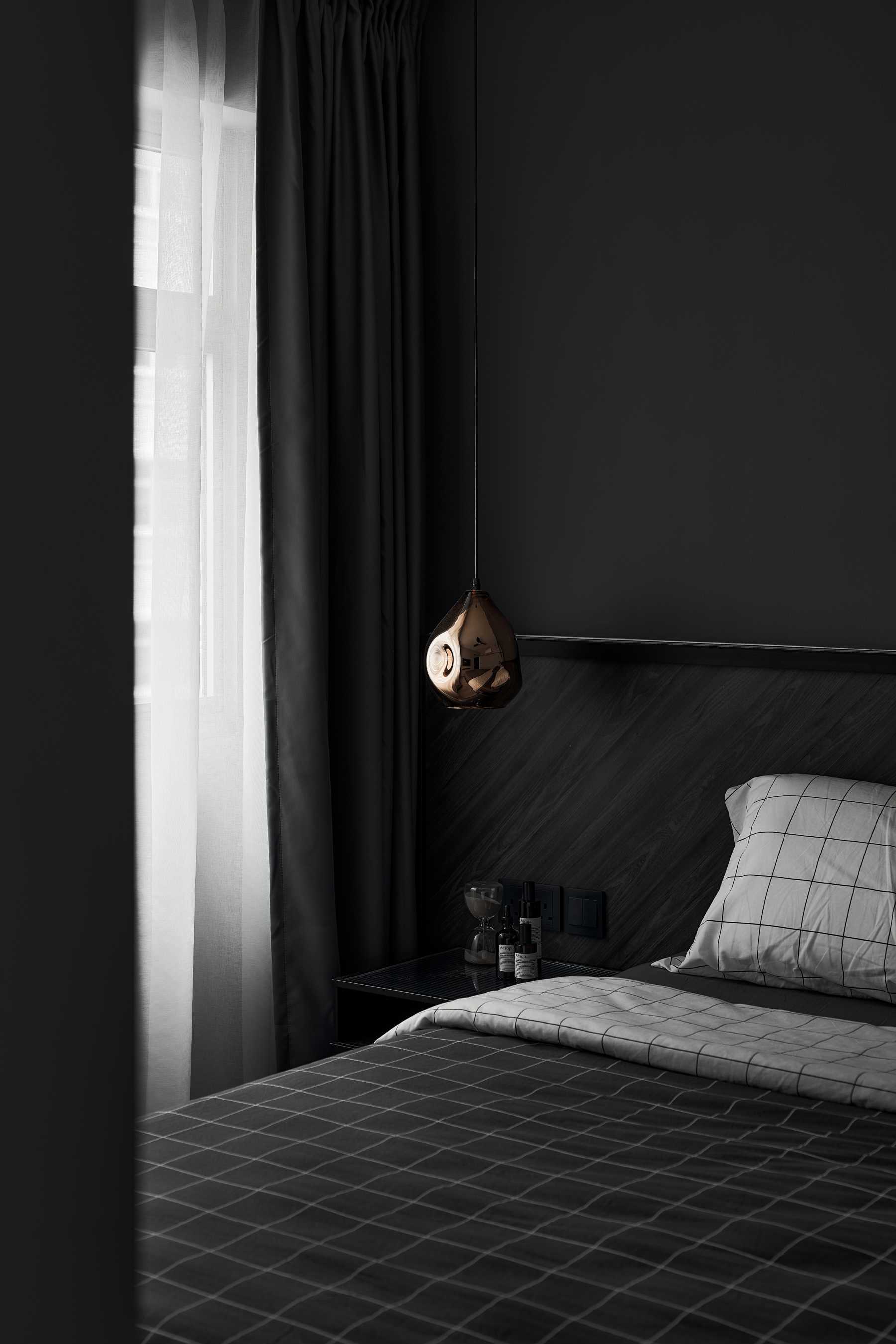 Modern Bedroom with Drop Light and Bedside Table