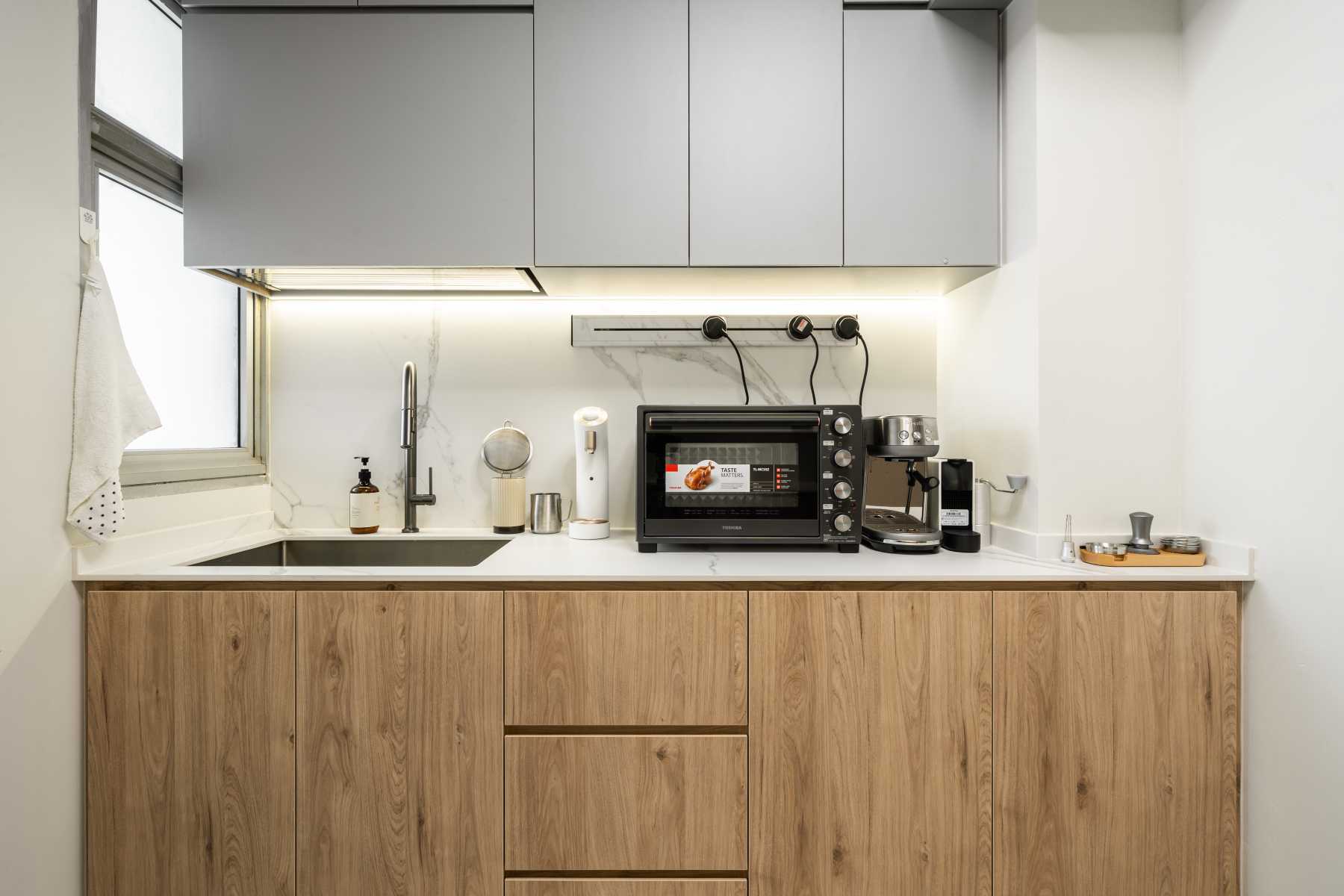 Scandinavian Kitchen with Wood Flooring and Kitchen Window