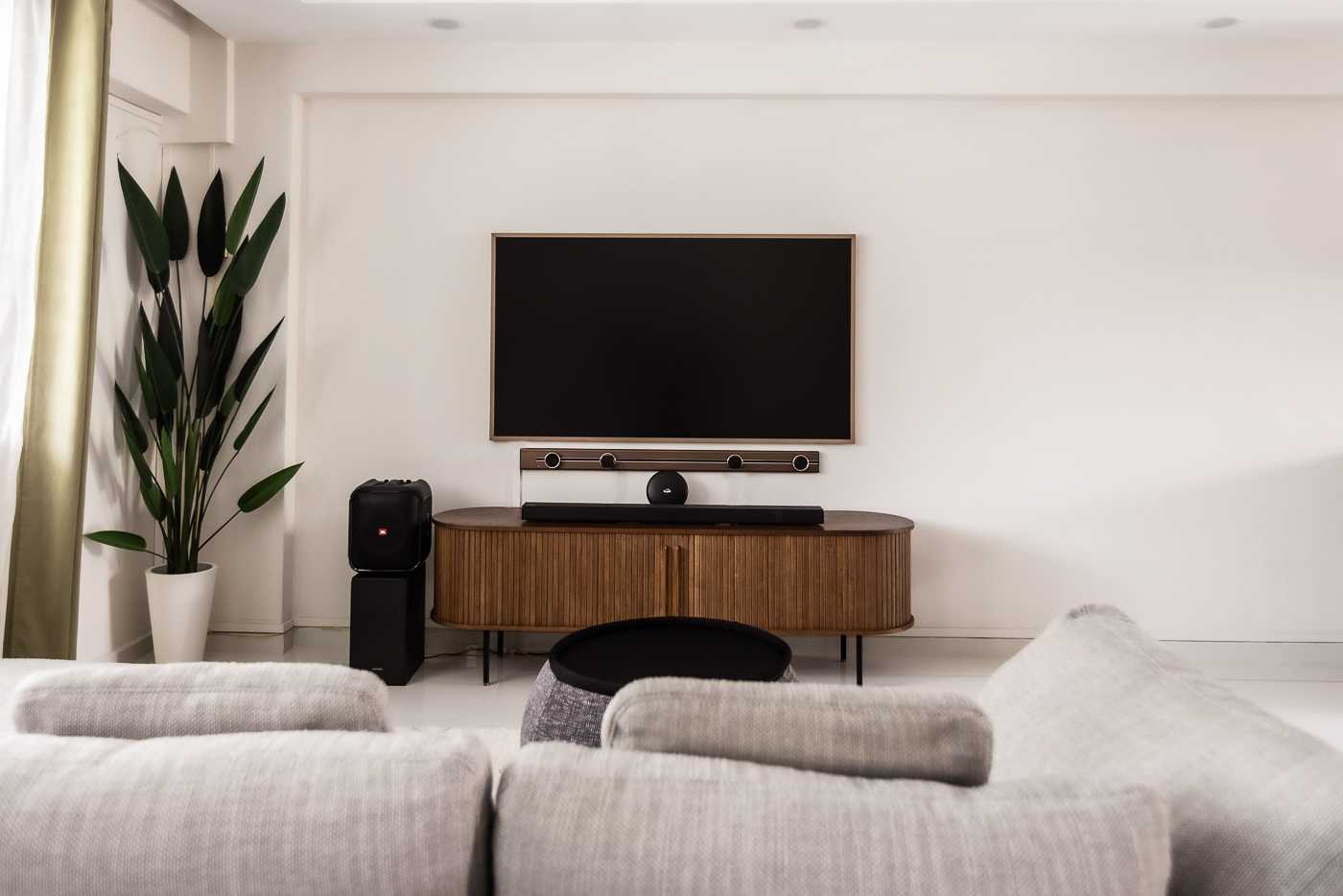 Modern Living Room with TV Console and Cove Lighting
