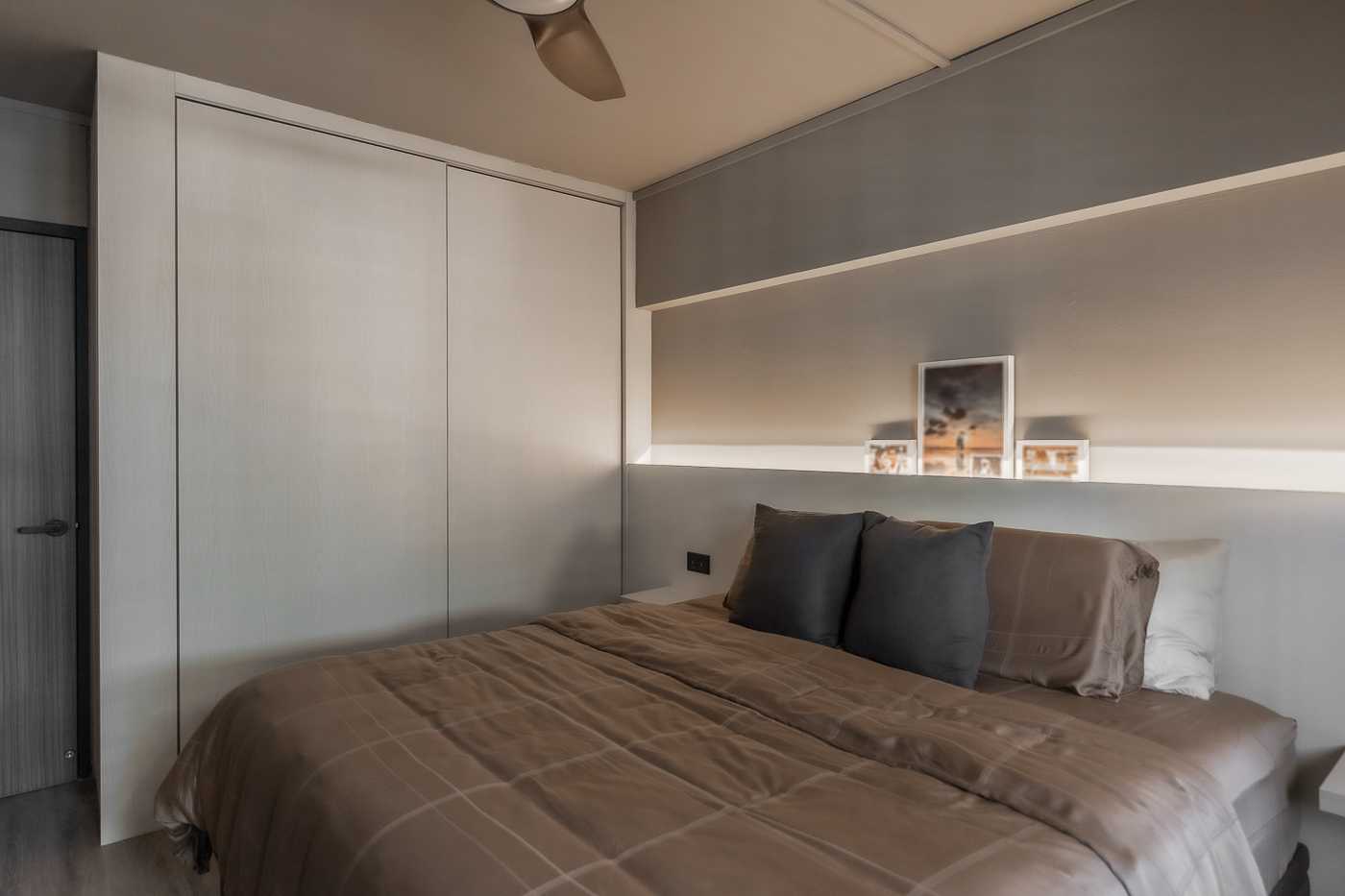 Modern Bedroom with Cove Lighting and Wardrobe