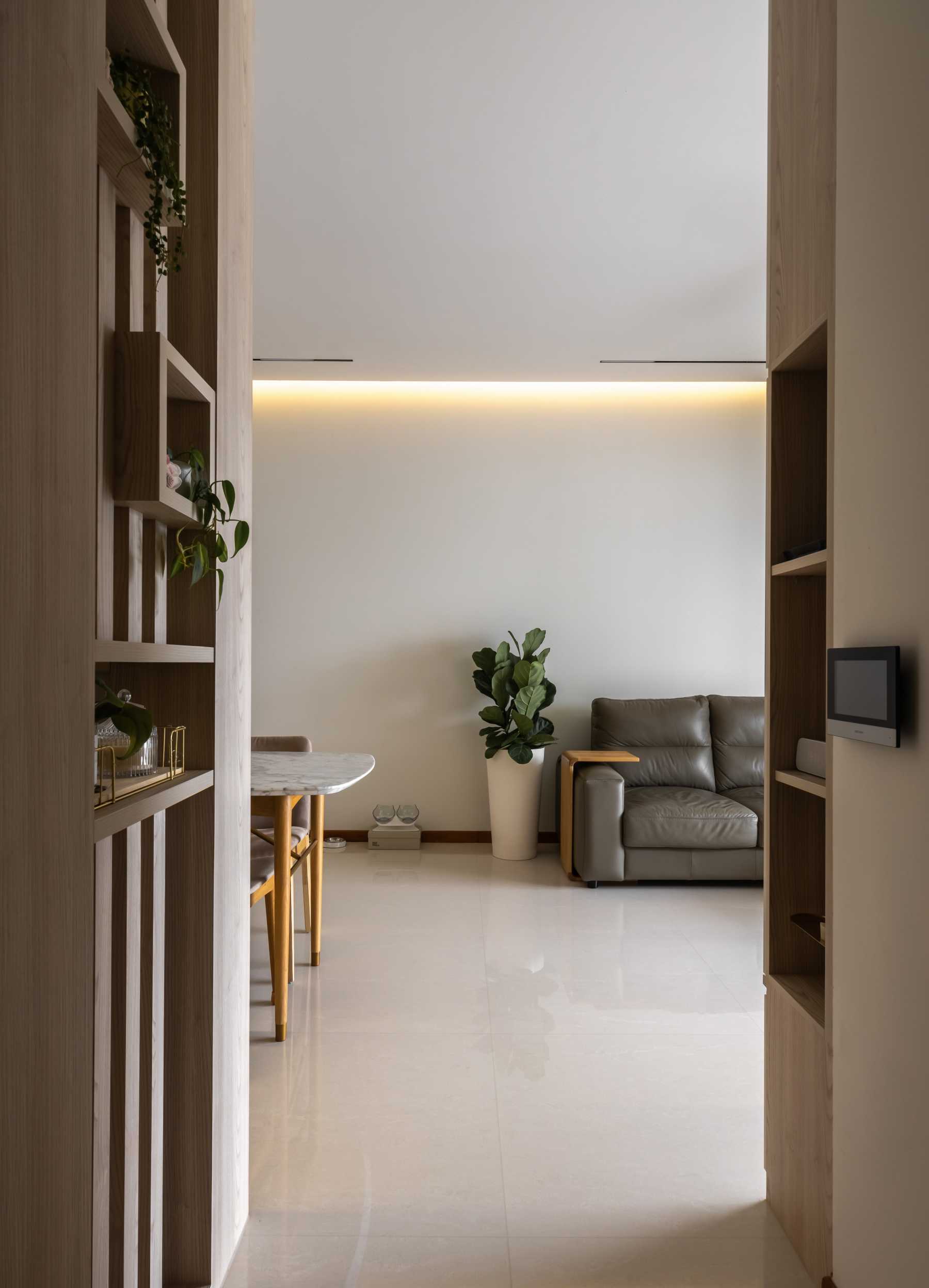 Contemporary Entryway with Feature Wall and Storage Cabinets