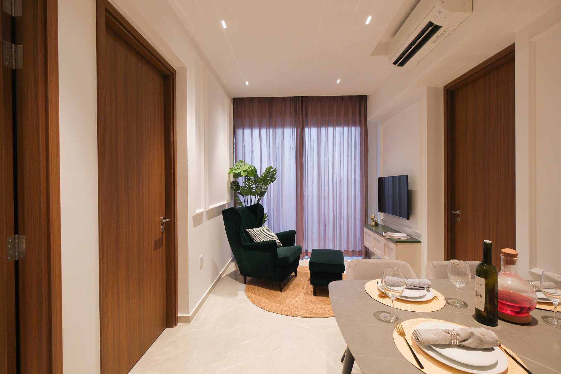 Modern Living Room with TV Console and Armchairs