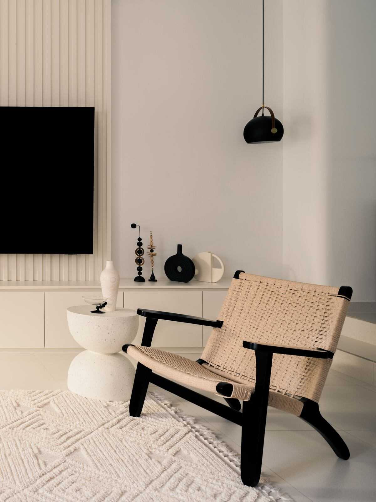Minimalist Living Room with Homogeneous Tiles and TV Console