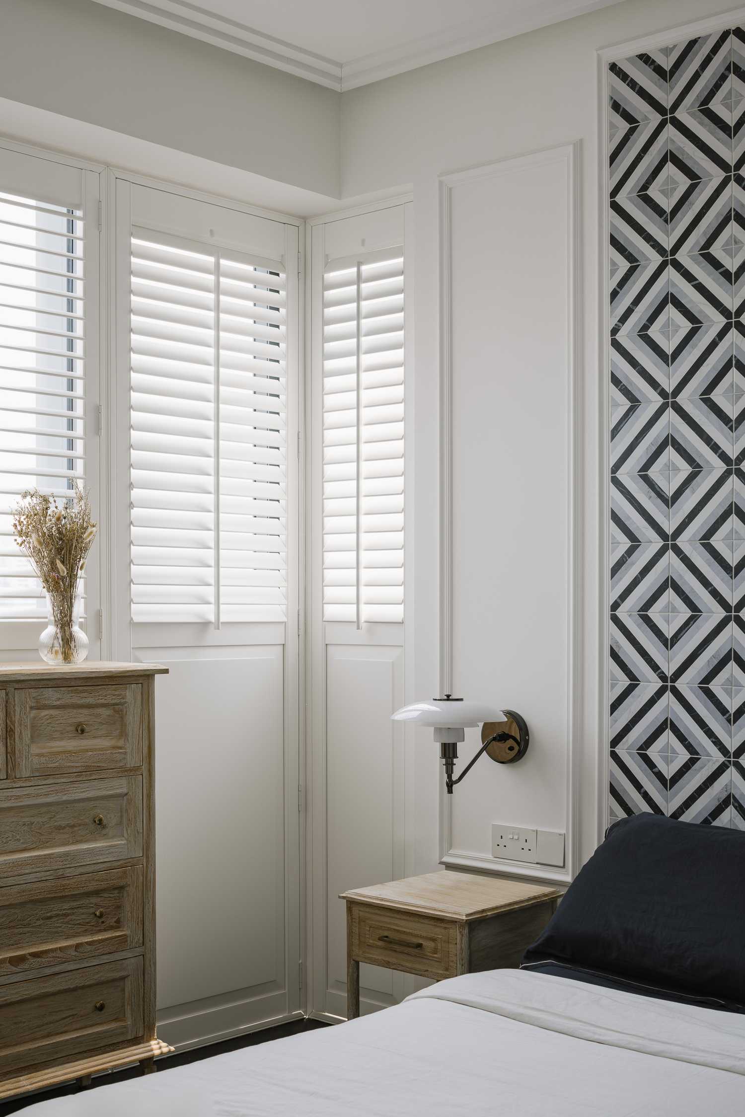 Modern Bedroom with Window Shutters and Bedside Table