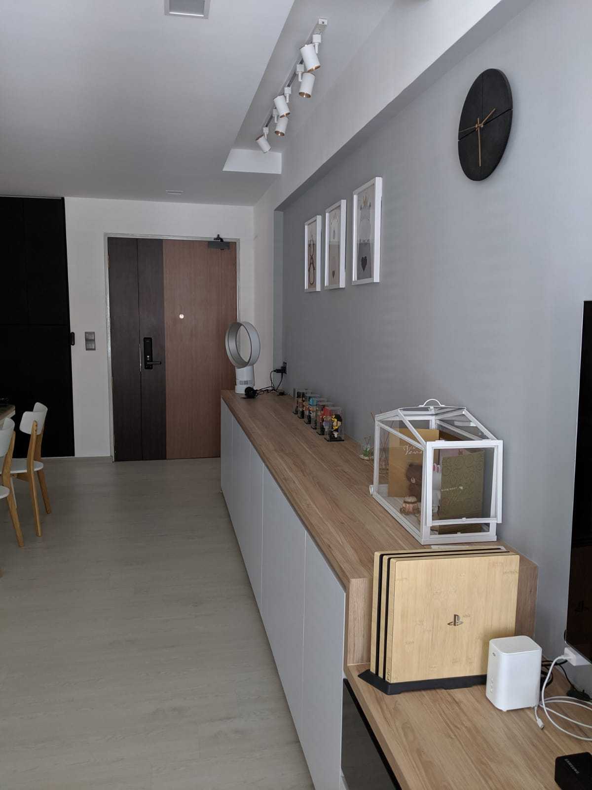 Scandinavian Hallway with Bookshelf and Artwork