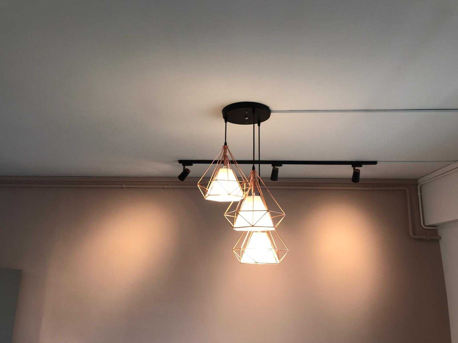 Minimalist Dining Room with Chandelier and Lighting