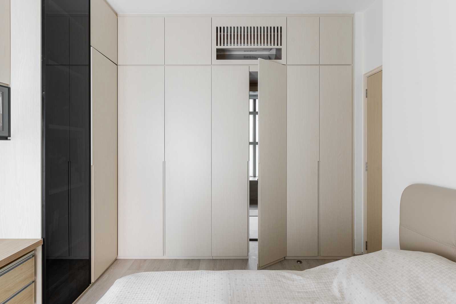 Scandinavian Bedroom with Wood Flooring and Closet