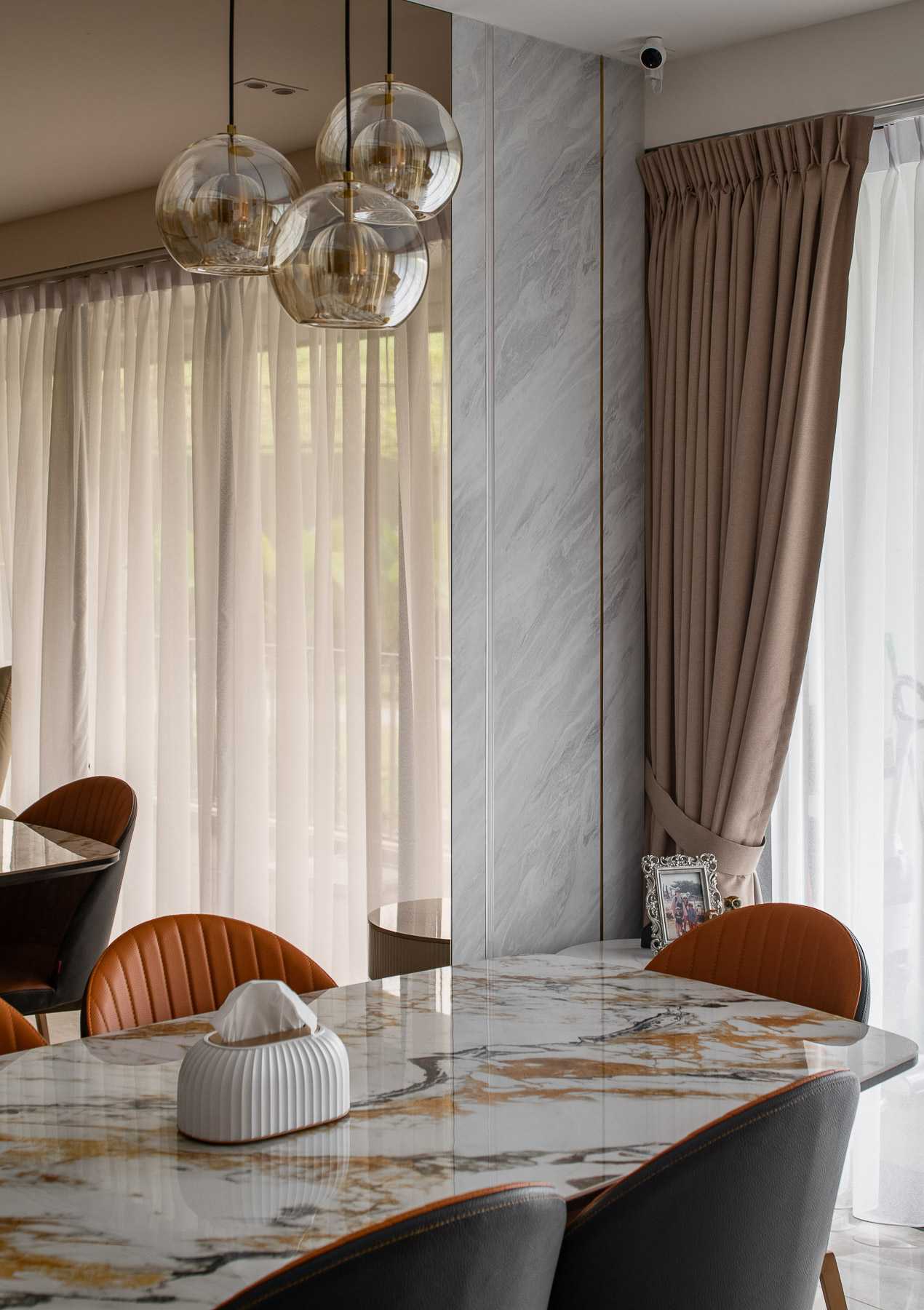 Contemporary Dining Room with Chandelier and Dining Chairs