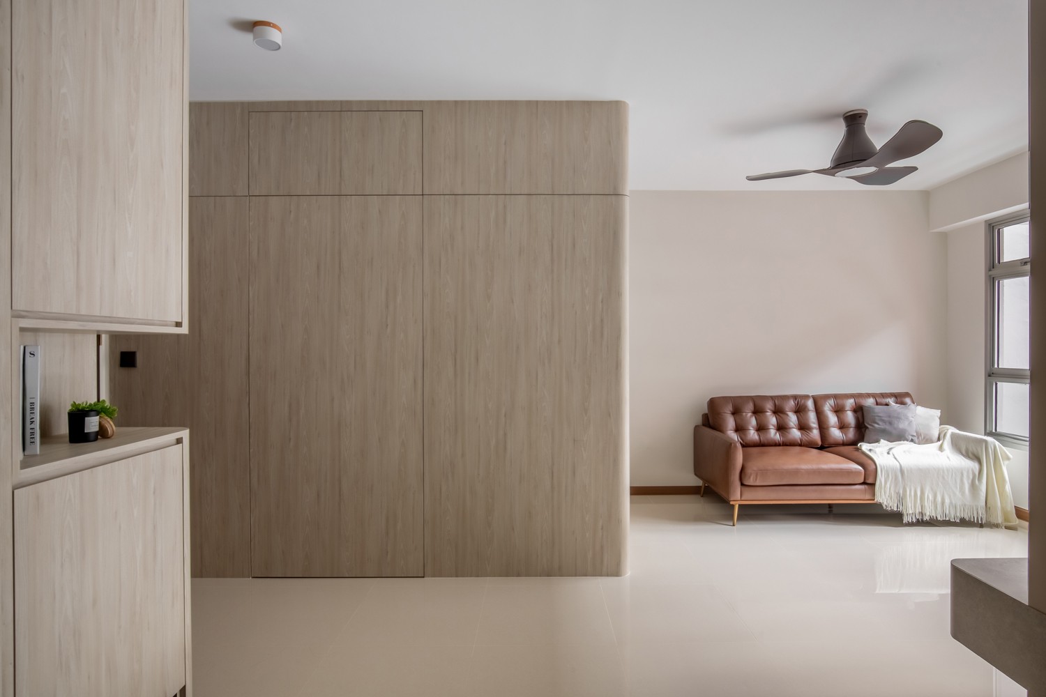 Modern Living Room with Homogeneous Tiles and Feature Wall