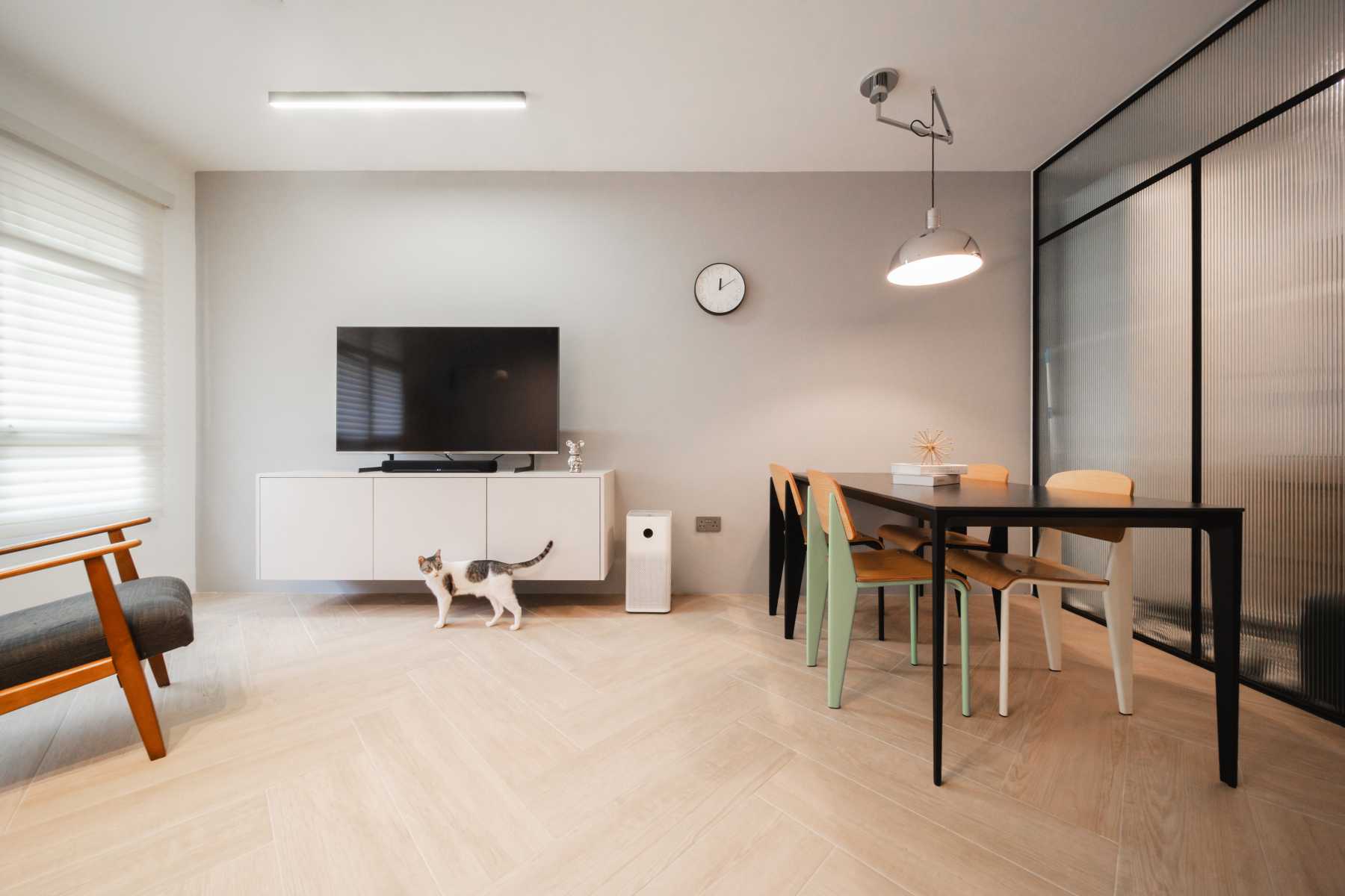 Contemporary Living Room with Herringbone Tiling and TV Console