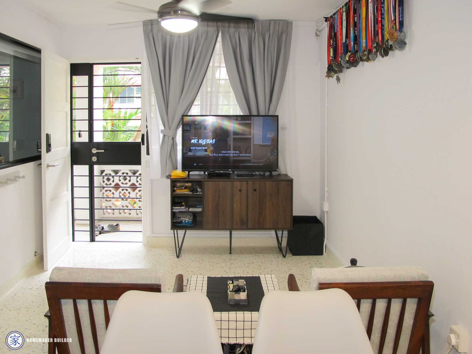 Vintage Living Room with TV Console and Ceiling Fan