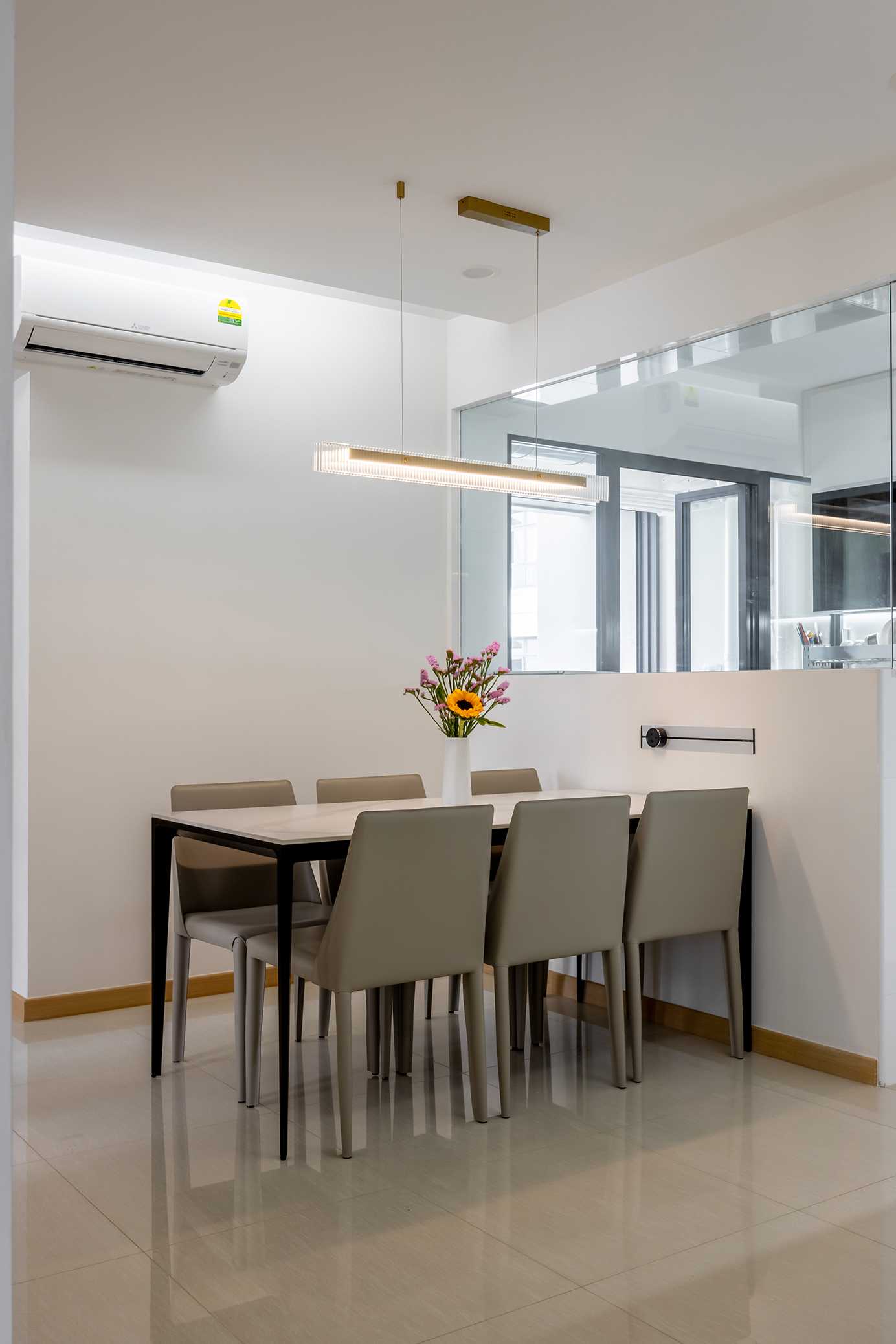 Minimalist Dining Room with Chandelier and Dining Table