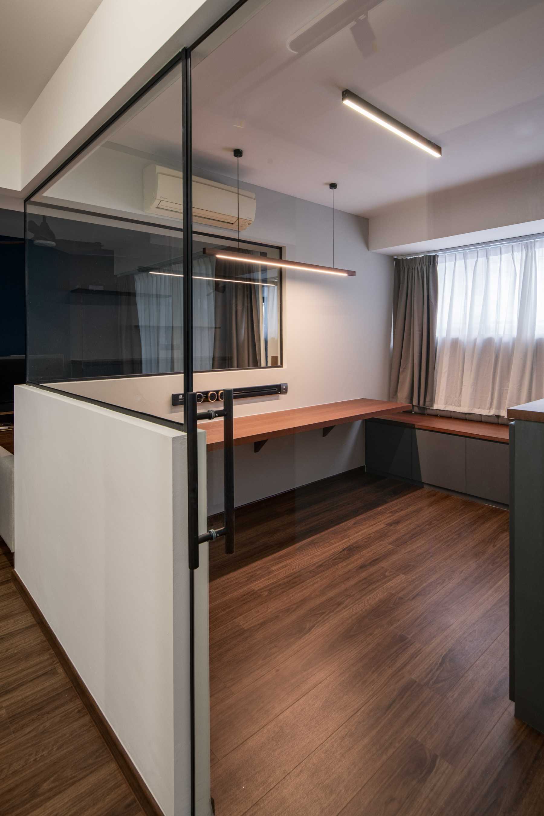 Contemporary Home Office with Bay Window and Desk