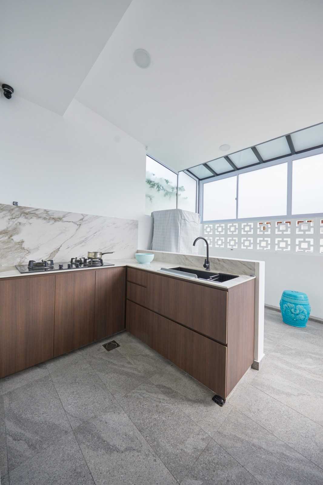 Minimalist Kitchen with Herringbone Tiling and Wood Flooring