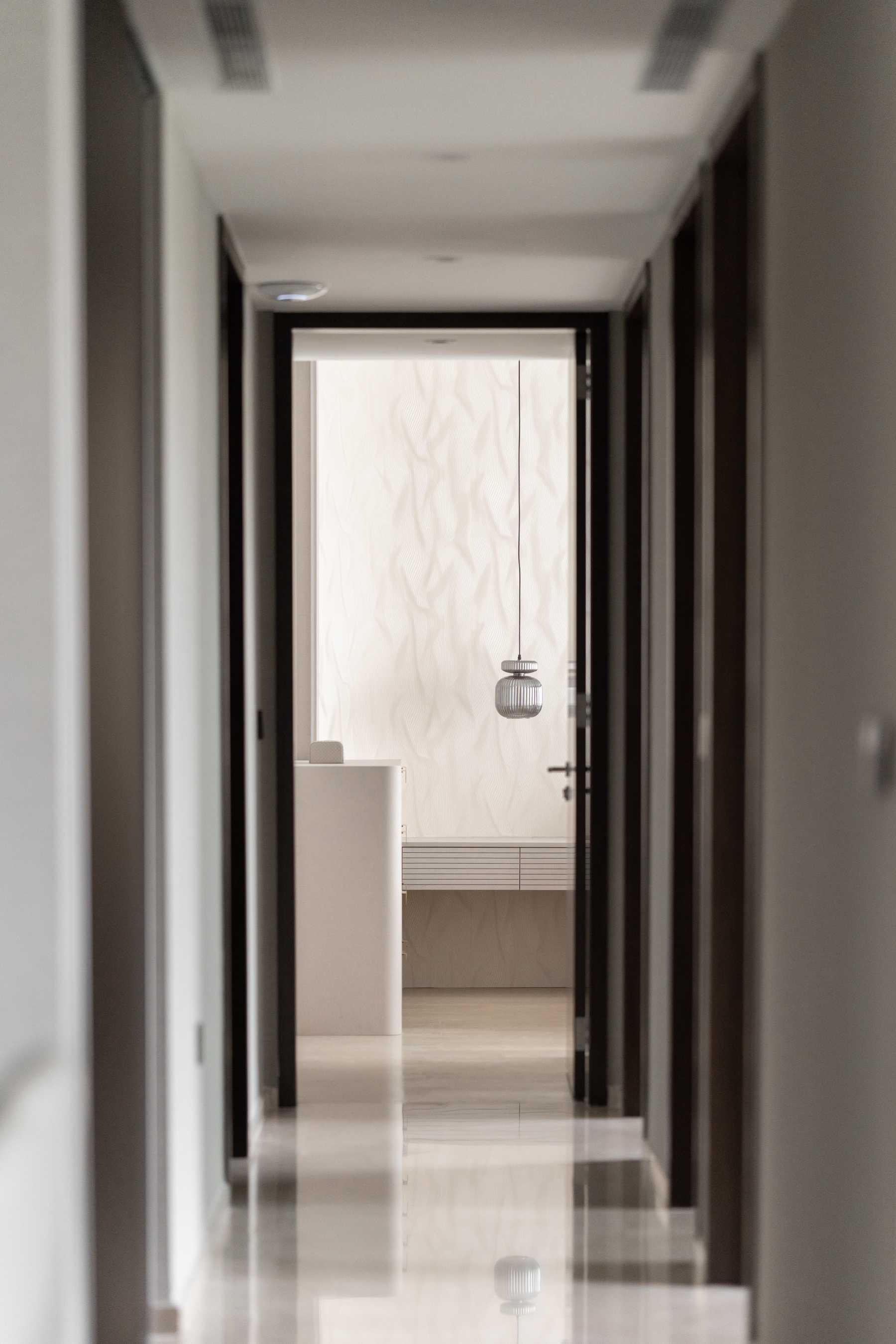Contemporary Hallway with Artwork and Console Table