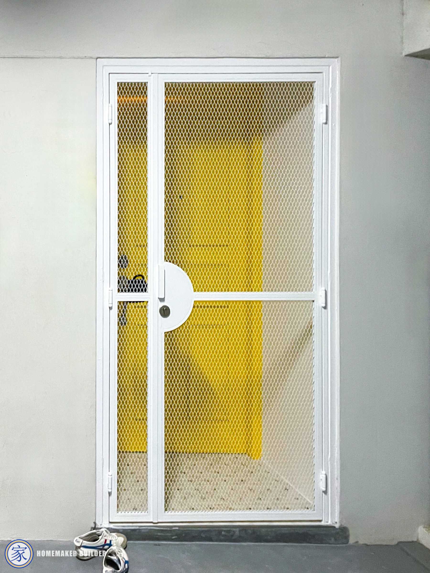 Eclectic Entryway with Metal Gate and Paintings