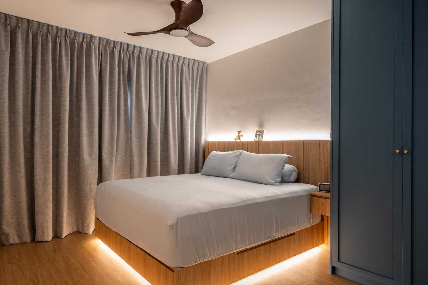 Country Bedroom with Platform Bed and Wood Flooring