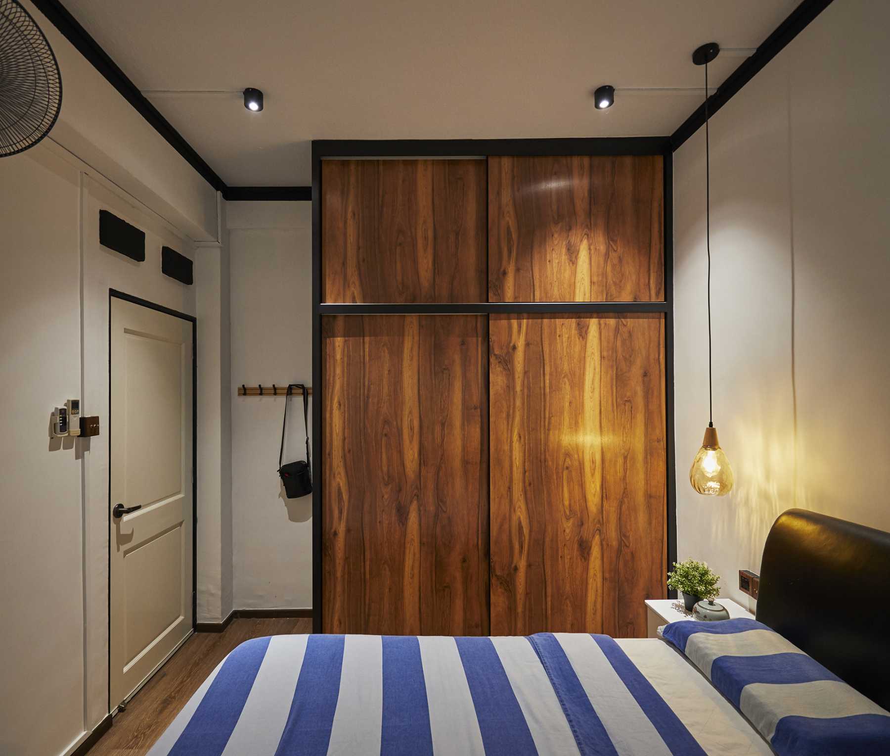 Asian Bedroom with Cement Floor and Bay Window