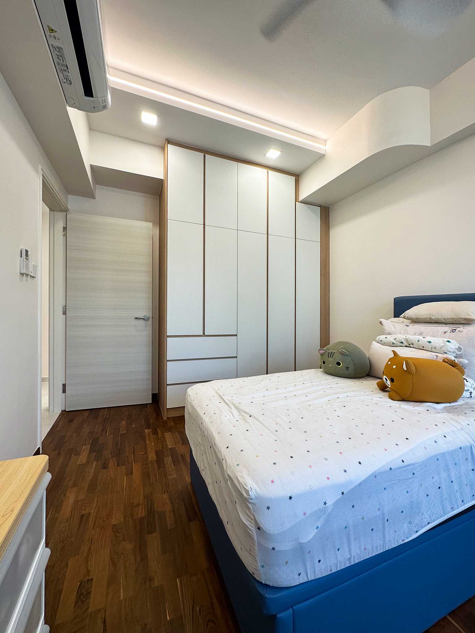Scandinavian Bedroom with Cove Lighting and Wardrobe