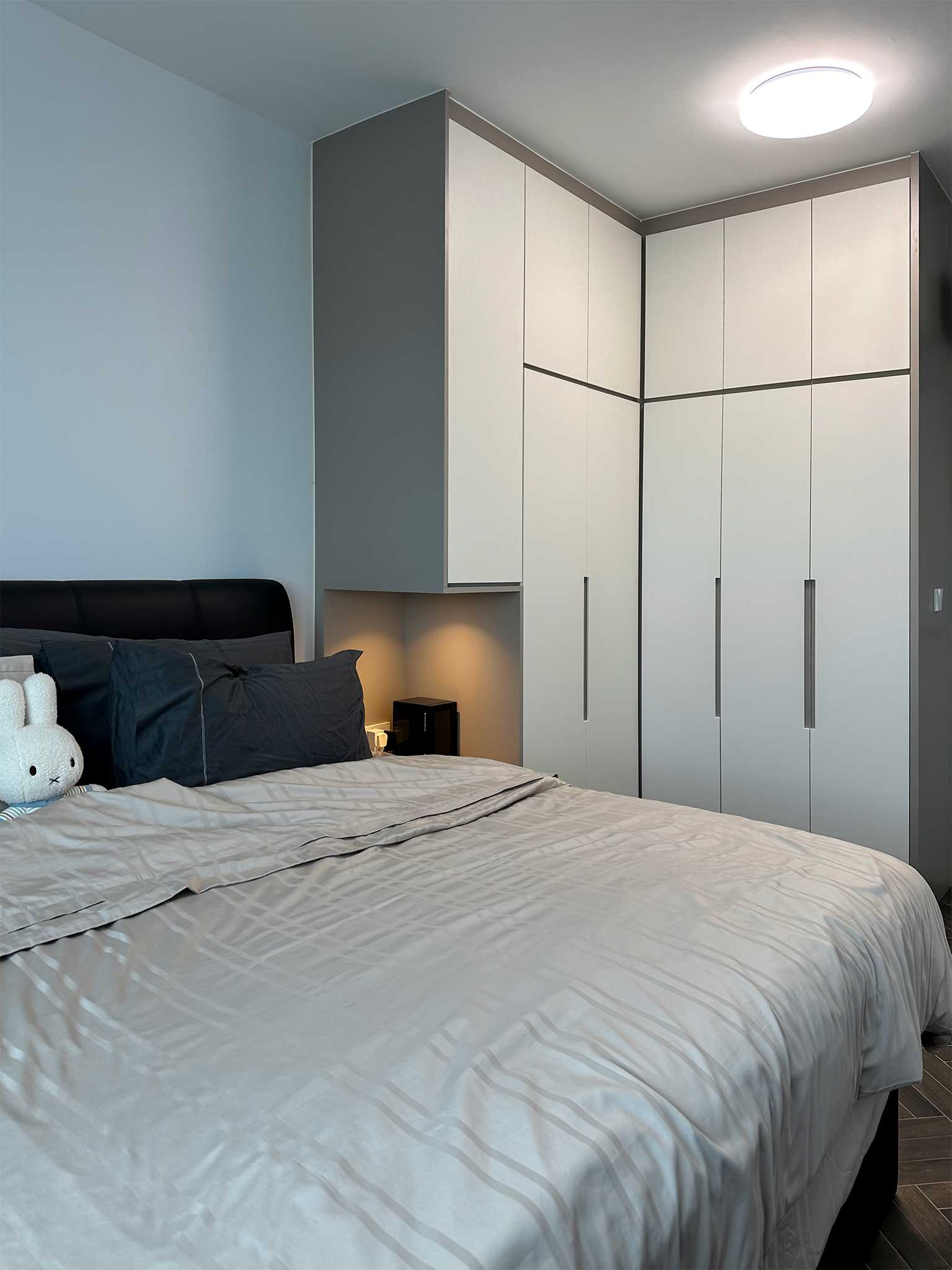 Scandinavian Bedroom with Marble Floor and Wood Flooring
