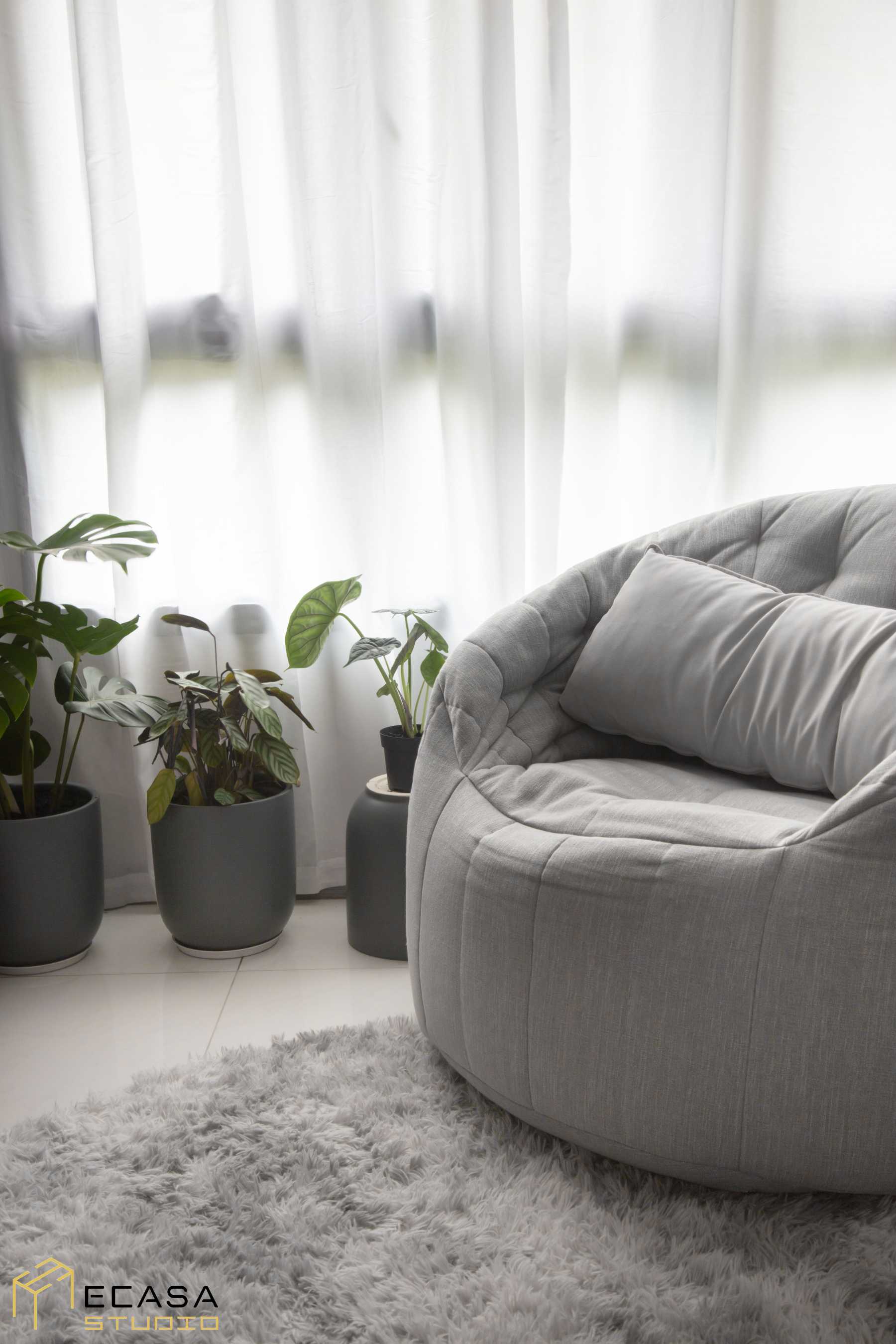 Modern Living Room with Cement Floor and Carpet