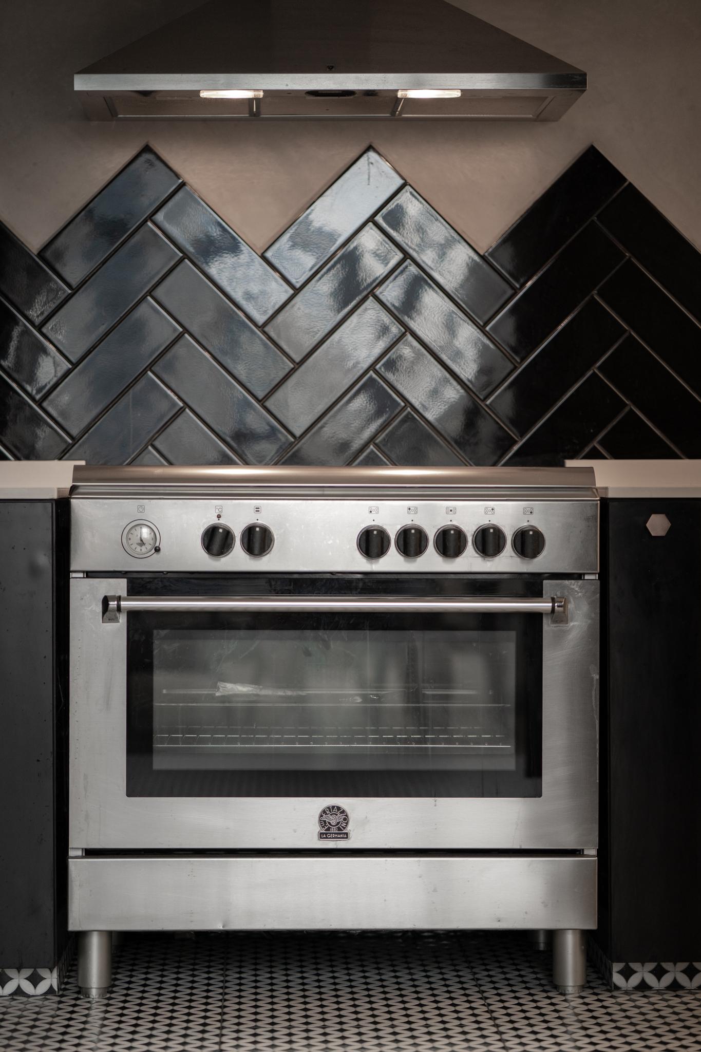 Industrial Kitchen with Kitchen Cabinets and Oven