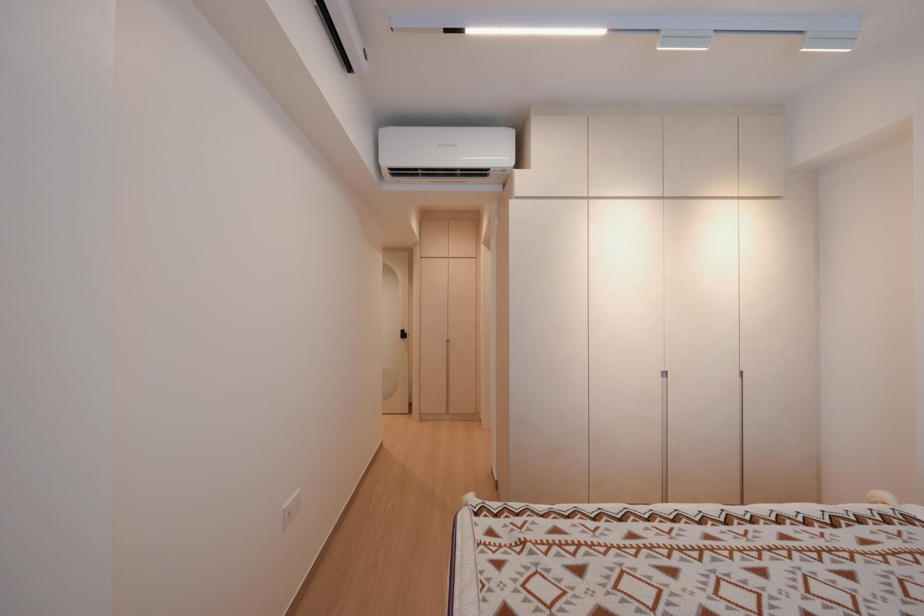 Minimalist Bedroom with Cove Lighting and Wardrobe