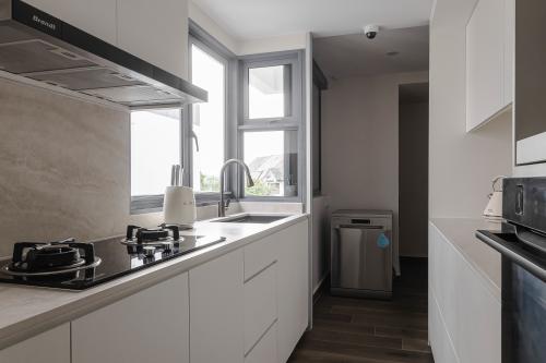 Contemporary Kitchen at The Sixth Avenue Residences