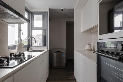 Contemporary Kitchen at The Sixth Avenue Residences