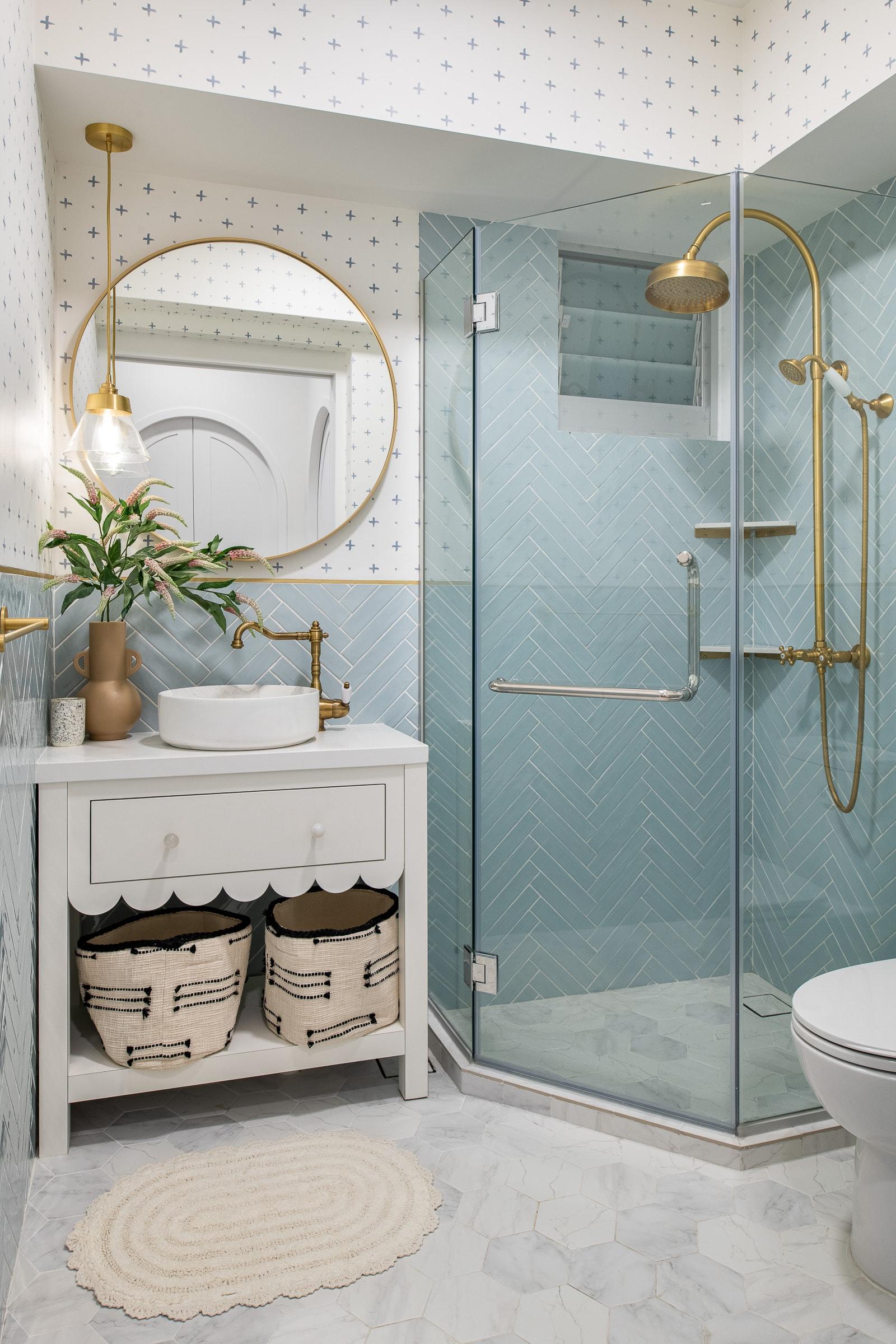 Minimalist Bathroom with Herringbone Tiling and Mirror