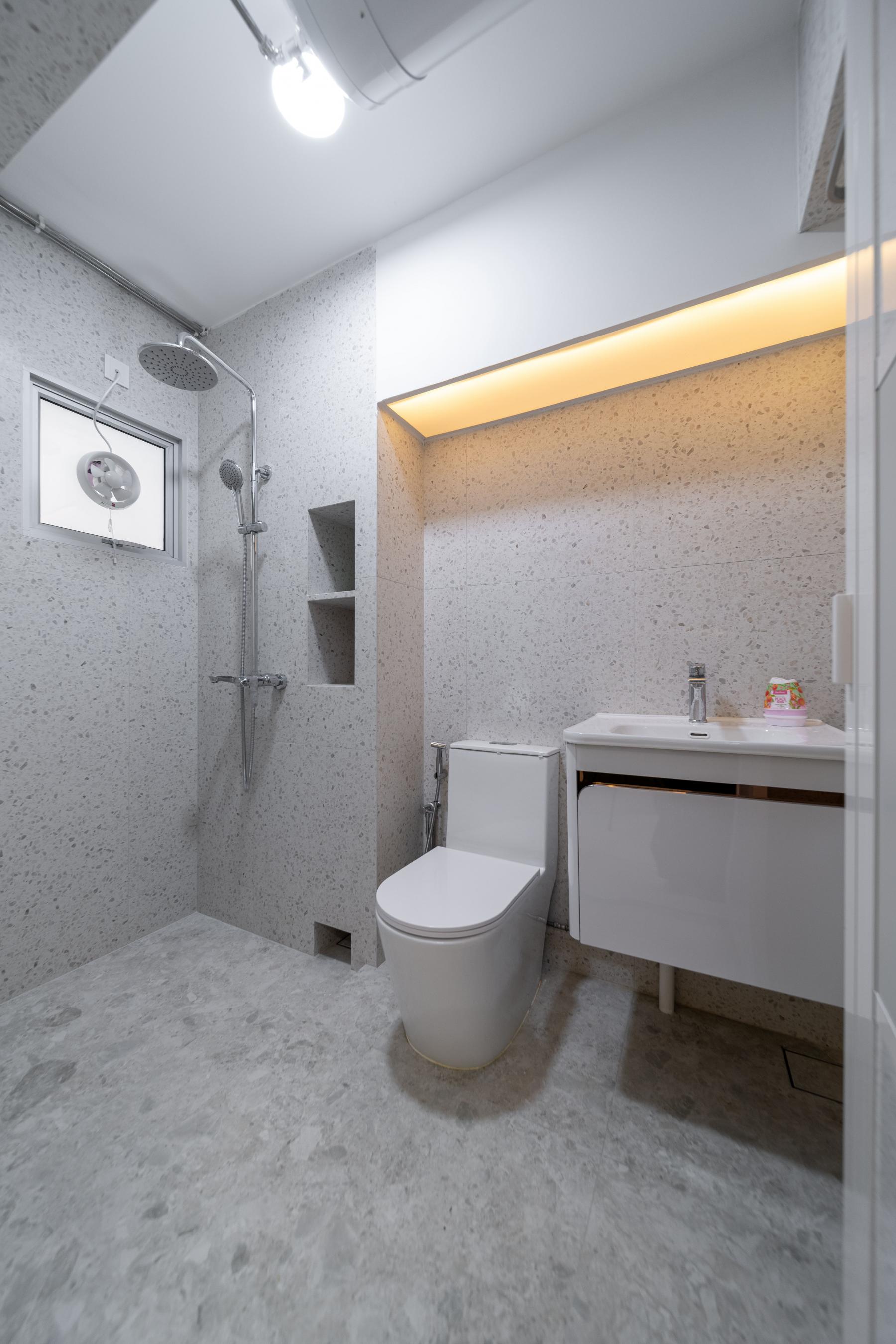 Modern Bathroom with Homogeneous Tiles and Showers