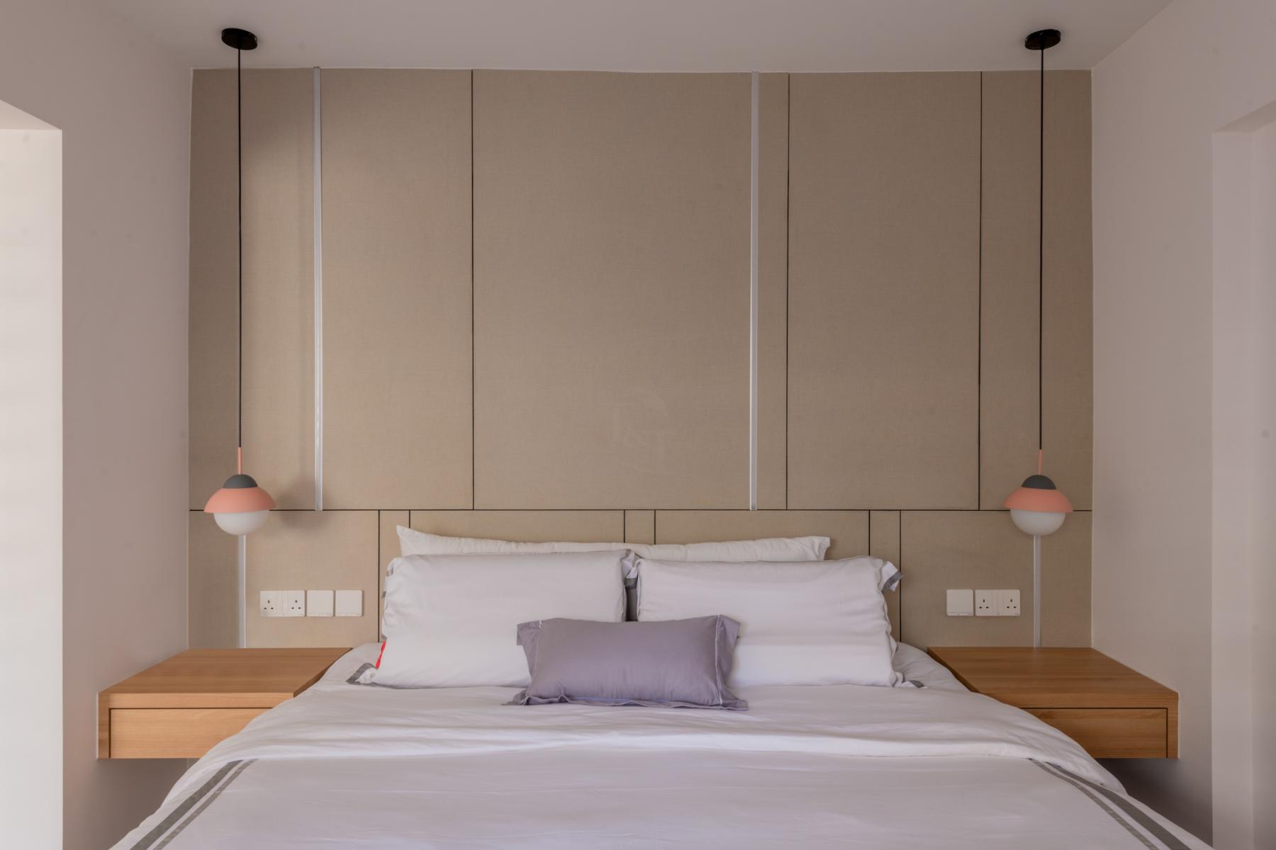Contemporary Bedroom with Feature Wall and Drop Light