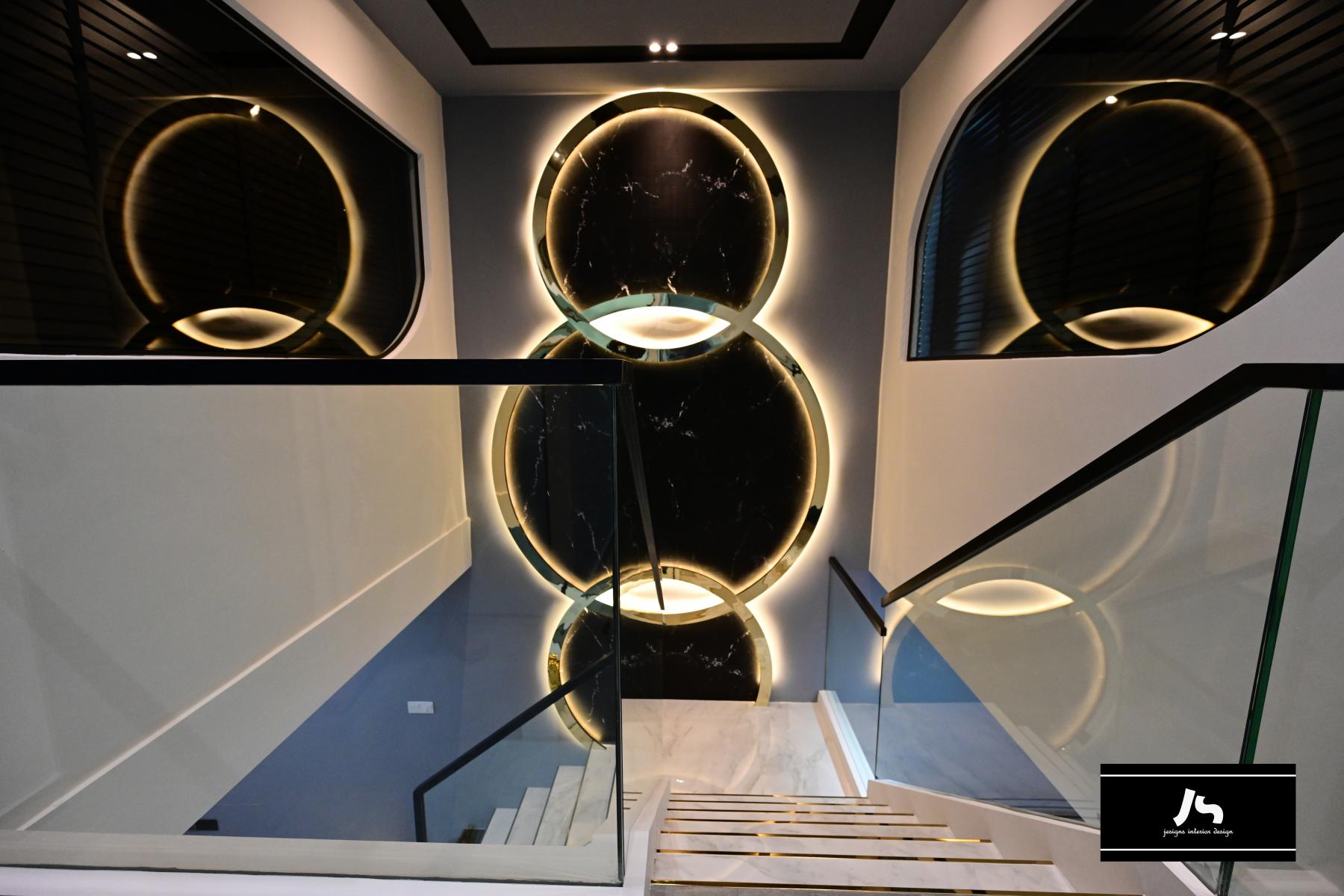 Modern Hallway with Staircase and Cove Lighting