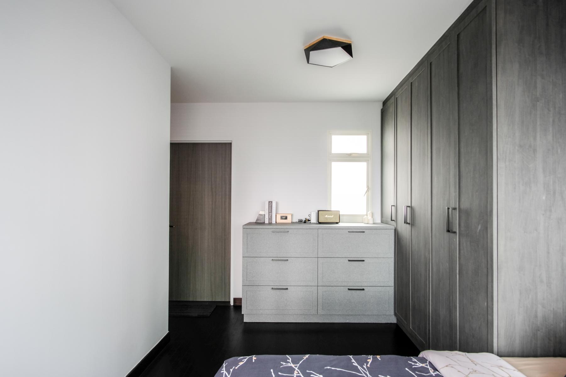 Industrial Bedroom with Ceiling Light and Drawer Units