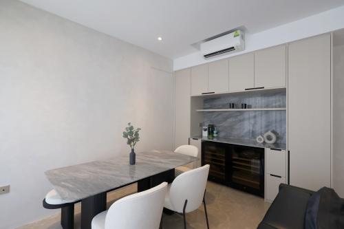 Minimalist Dining Room at 4 Bedroom Condo @ Amber Garden