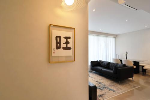 Minimalist Living Room at 4 Bedroom Condo @ Amber Garden