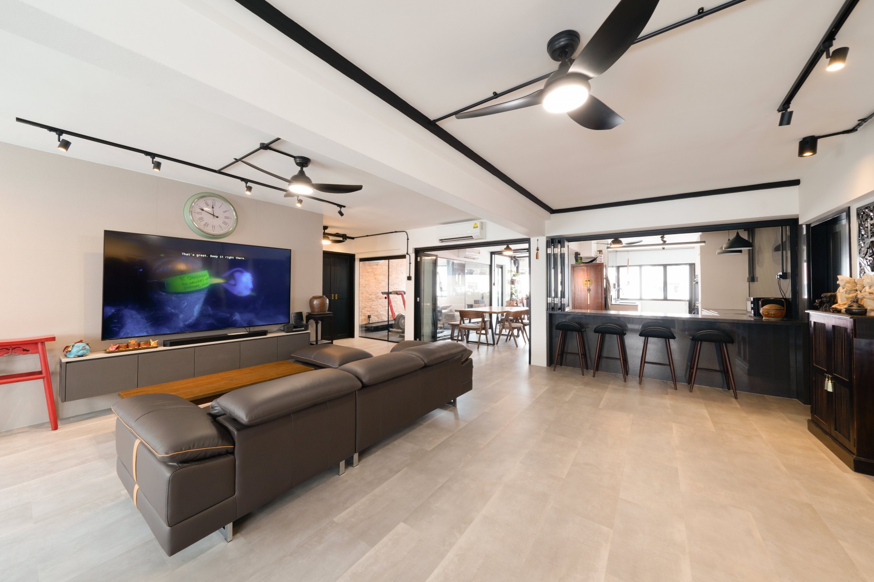 Industrial Living Room with Homogeneous Tiles and TV Console