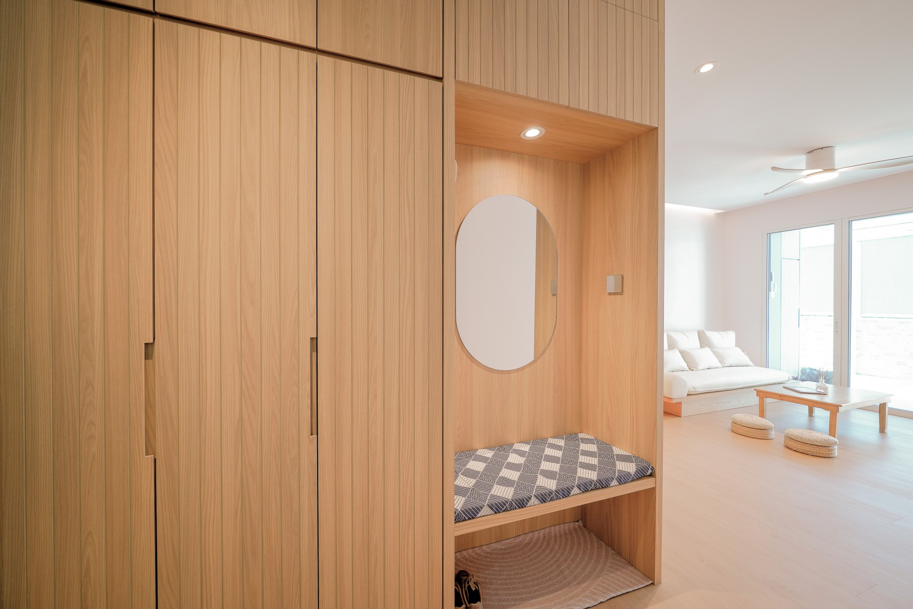 Scandinavian Entryway with Mirror and Seating Bench